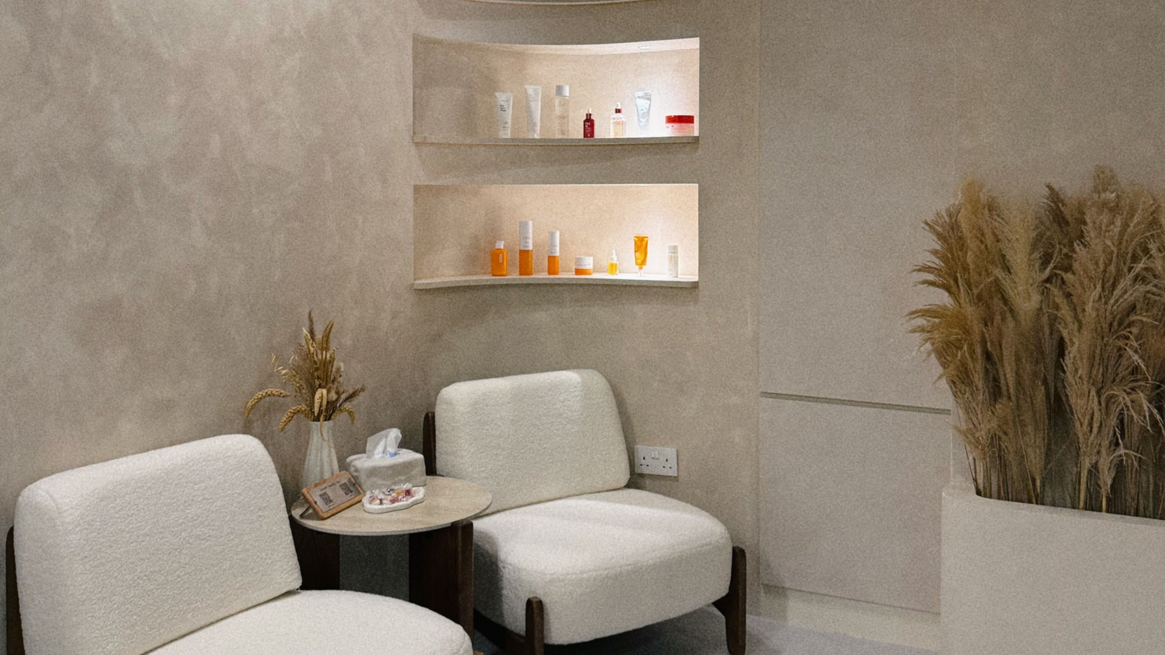 Cozy seating area at Cloud9 Beauty Bar (Bencoolen), Singapore, SG featuring elegant decor and beauty products.