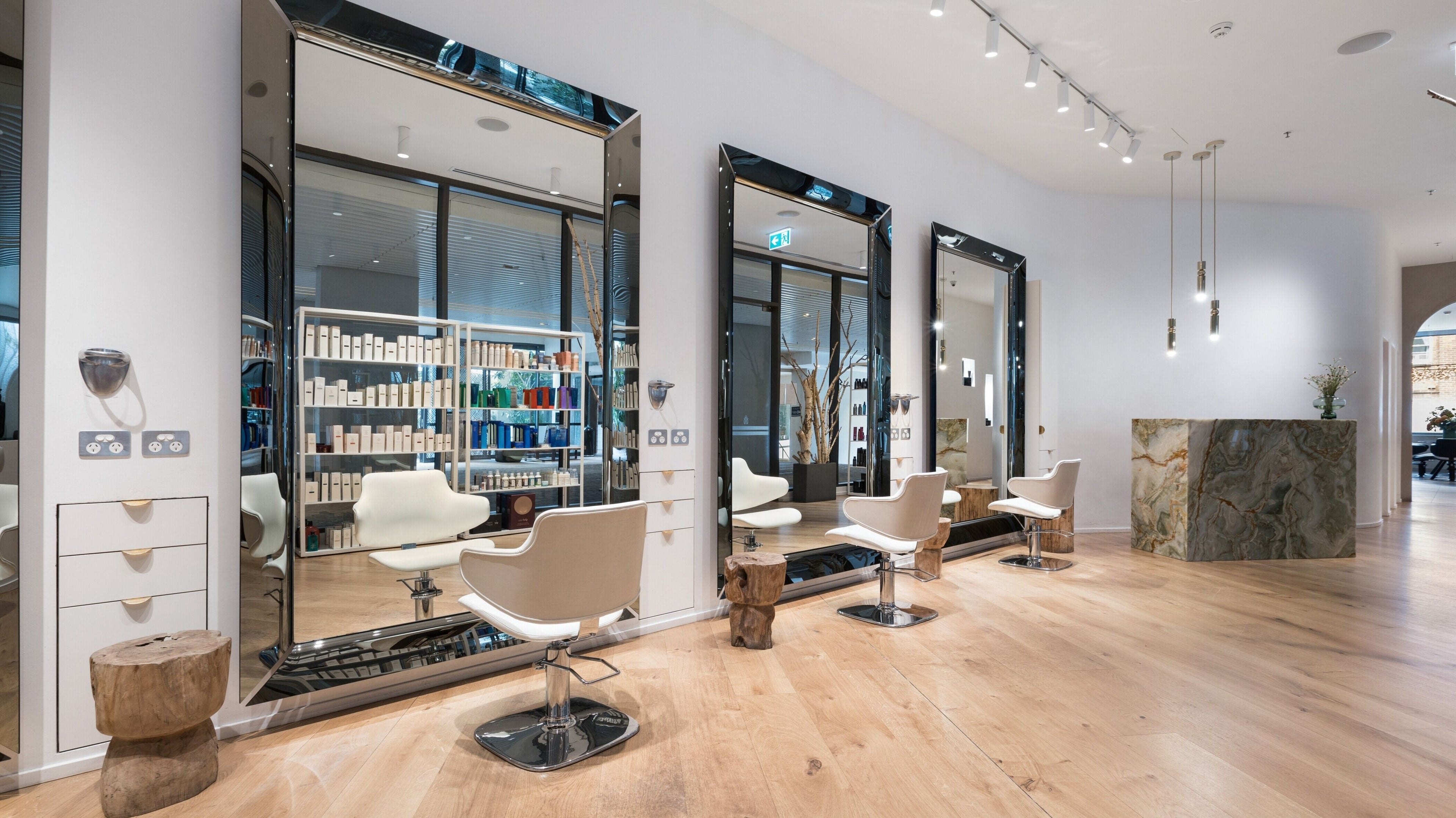 Stylish interior at Koda Cutters - Bondi, featuring sleek chairs and mirrors in Bondi Beach, New South Wales, AU.