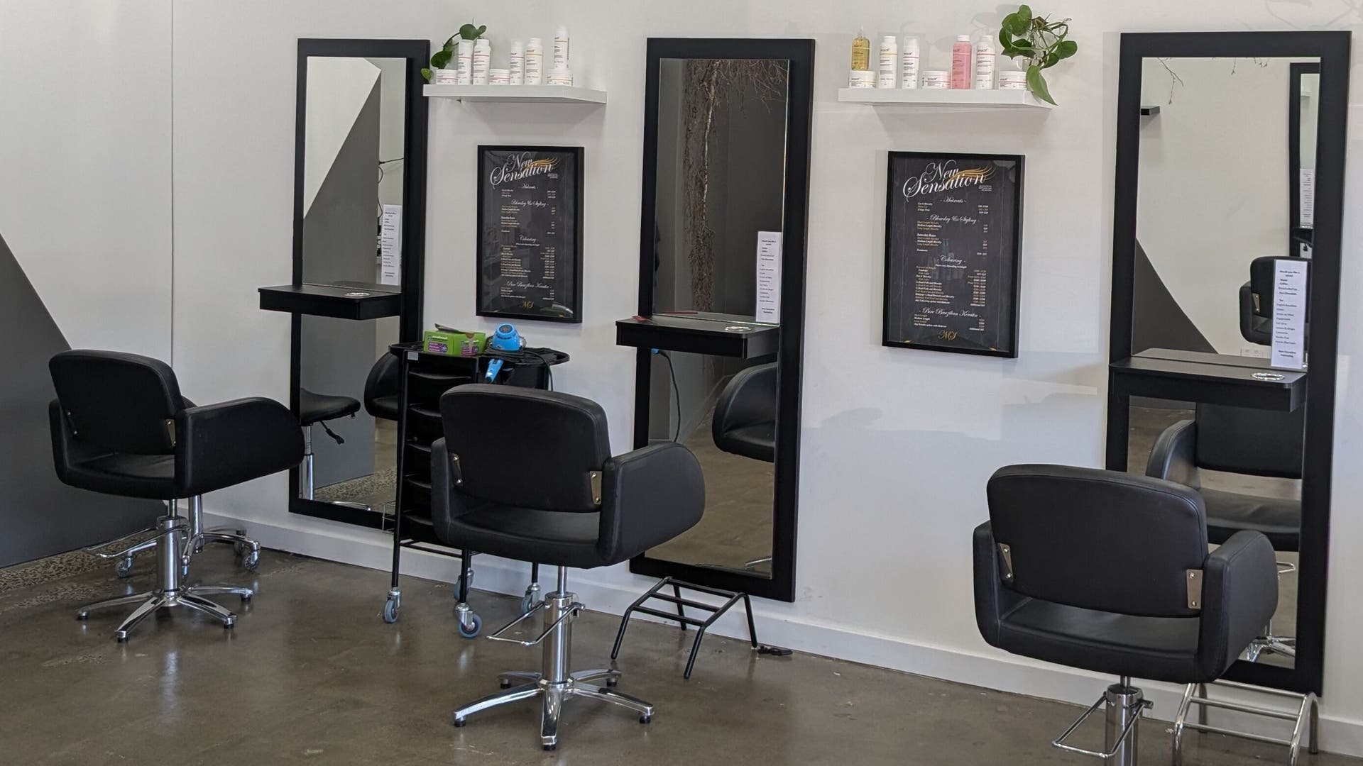 Modern salon chairs and mirrors at New Sensations Hairstyling in Melbourne, Victoria, AU, offering stylish hair services.