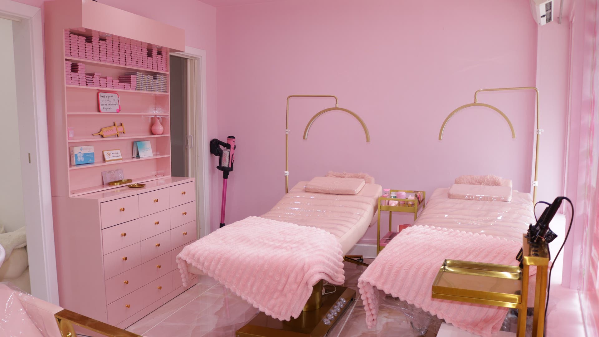Luxurious pink spa beds at By Sultan B in Hornchurch, England, GB, offering a calming wellness experience.
