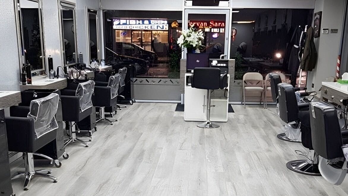 Modern interior of Terry’s Barbers & Hairdressers in Romford, England, GB featuring stylish barber chairs.