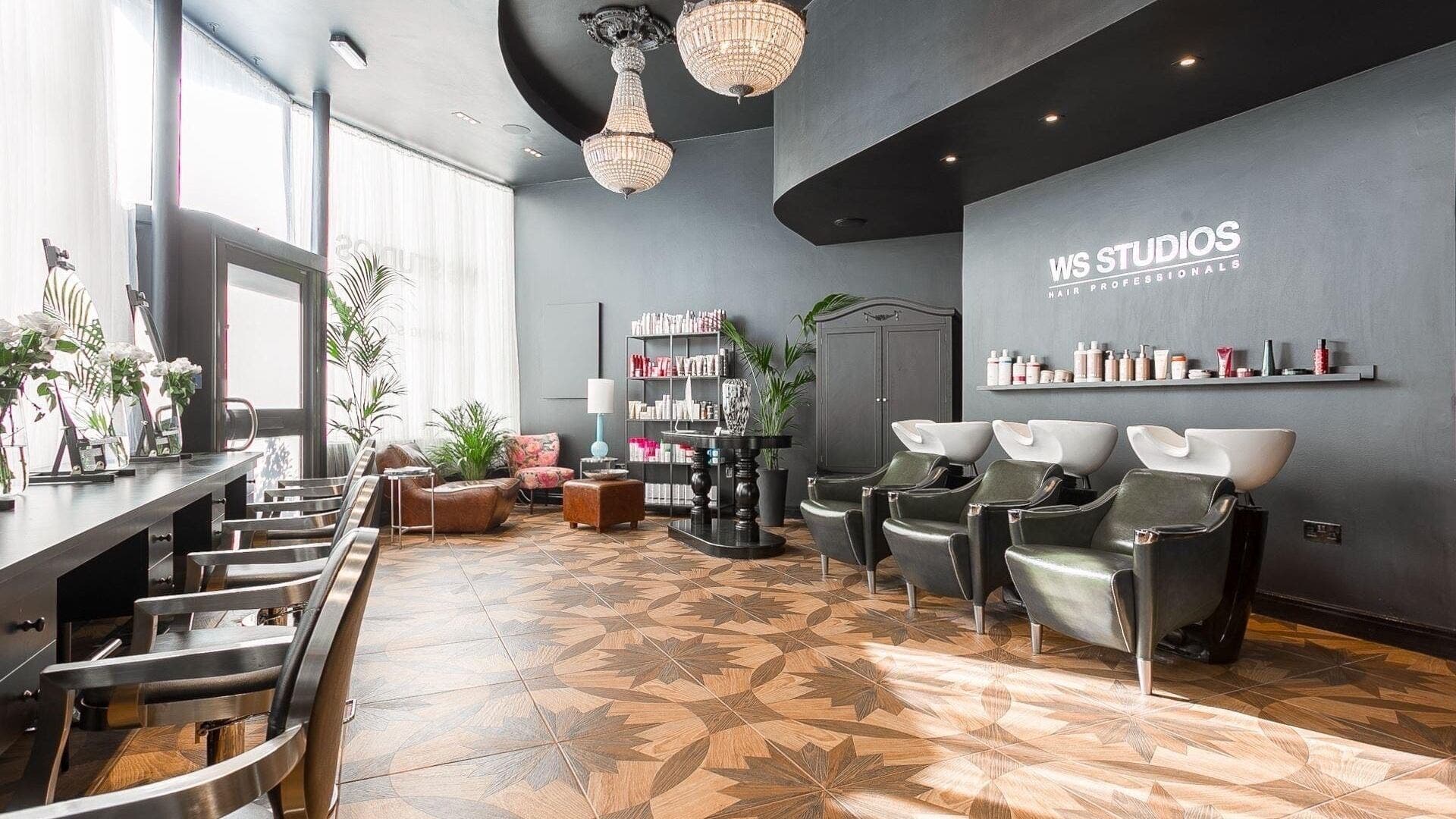 Elegant interior of WSSTUDIOS Hair Professionals, London, England, GB, showcasing stylish salon stations and decor.
