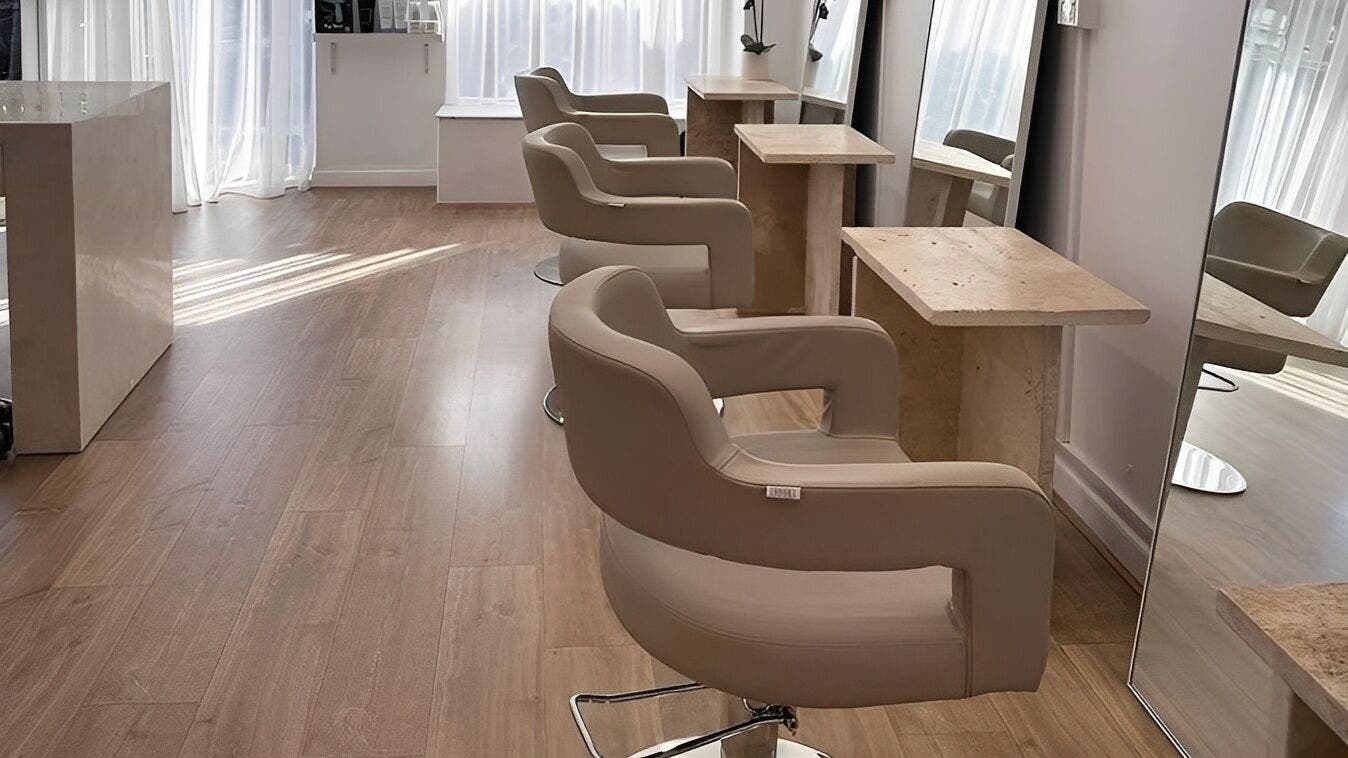 Elegant styling chairs and mirrors at Mica Hair, Melbourne, Victoria, AU, showcasing a modern salon interior.