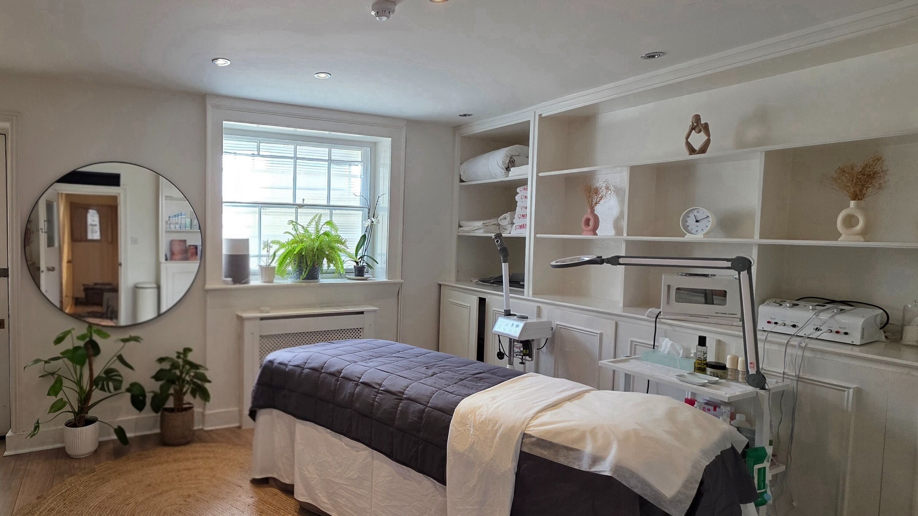 Relaxing treatment room at Faceformation Clinic, London, England, GB, featuring a massage bed and calming decor.
