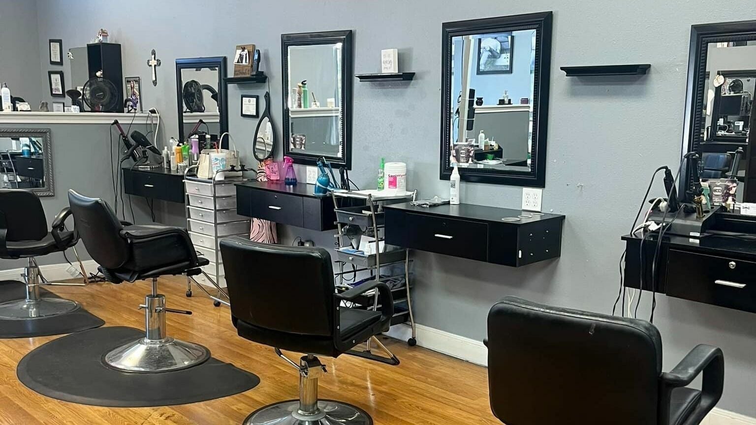 Interior of Beautify Me Hair and Lash Spa in Kingwood, Texas, US showing modern salon chairs and mirrors.