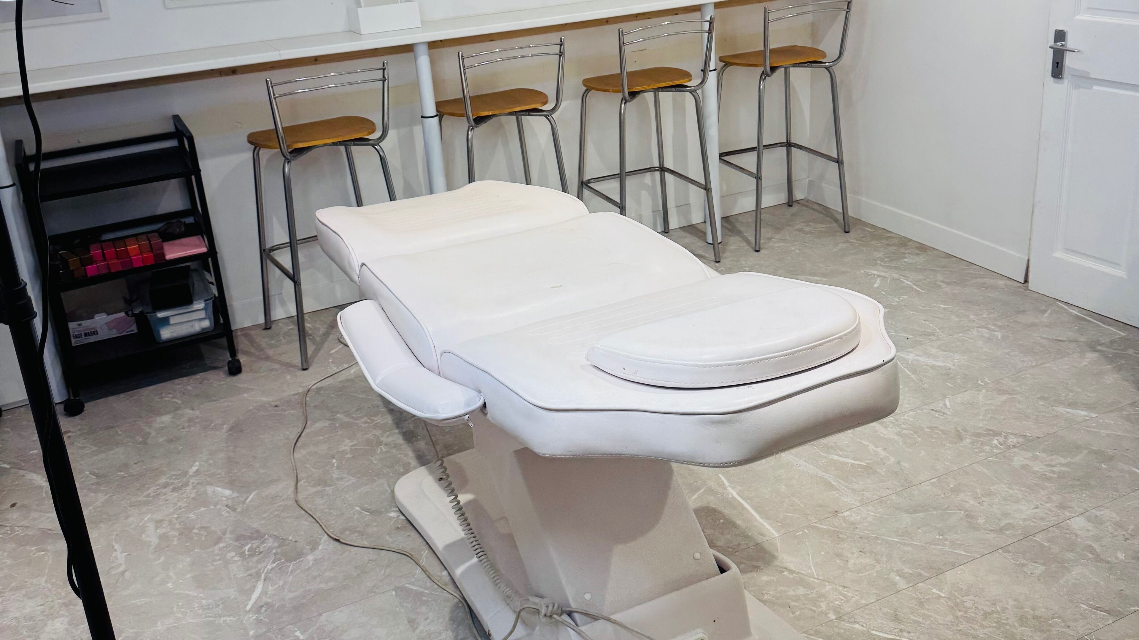 Spa treatment room at Limitless Salon with white treatment bed in Tonbridge, England, GB.