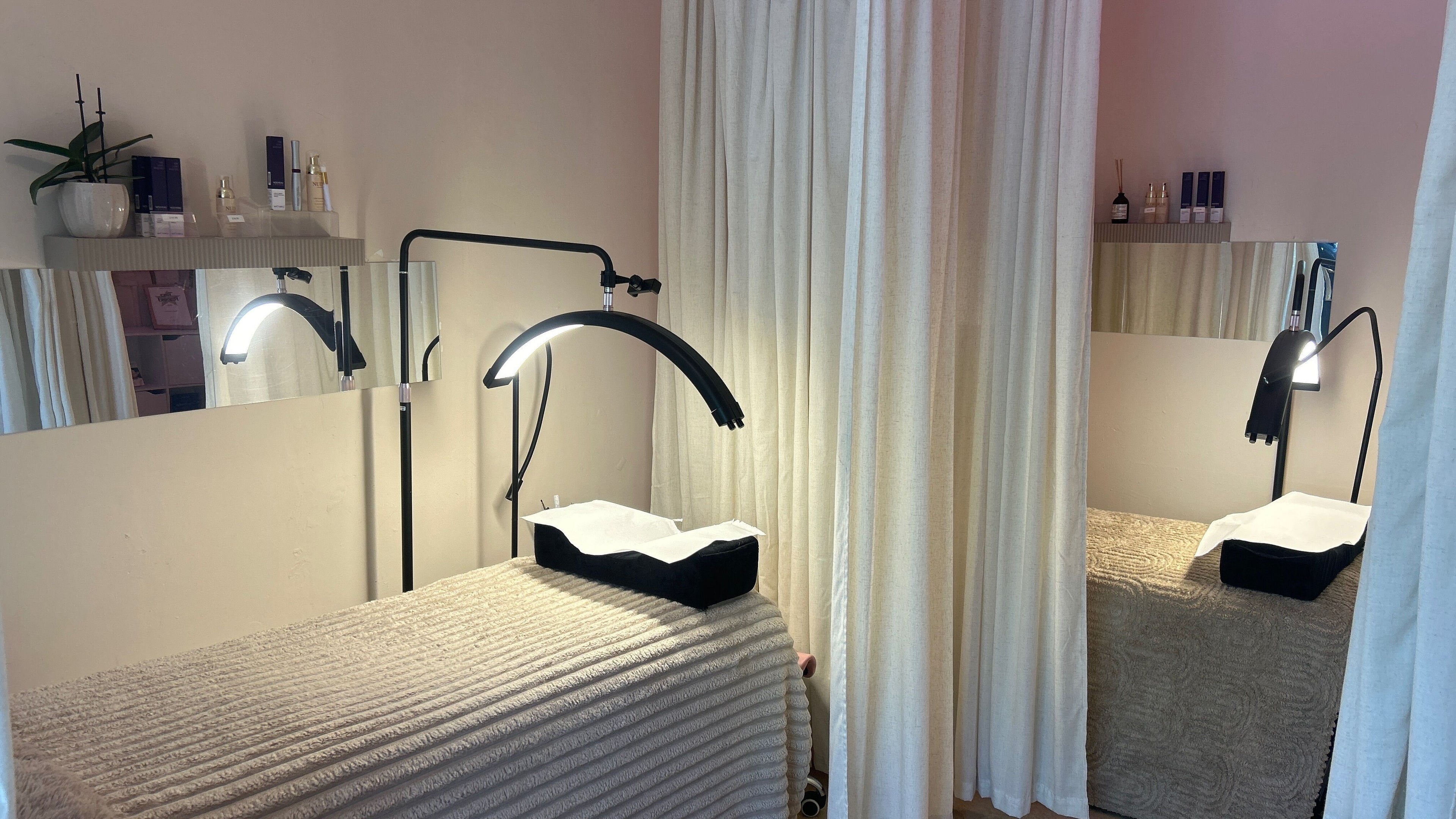 Relaxing treatment area at Nude London, featuring cozy beds and serene lighting in London, England, GB.