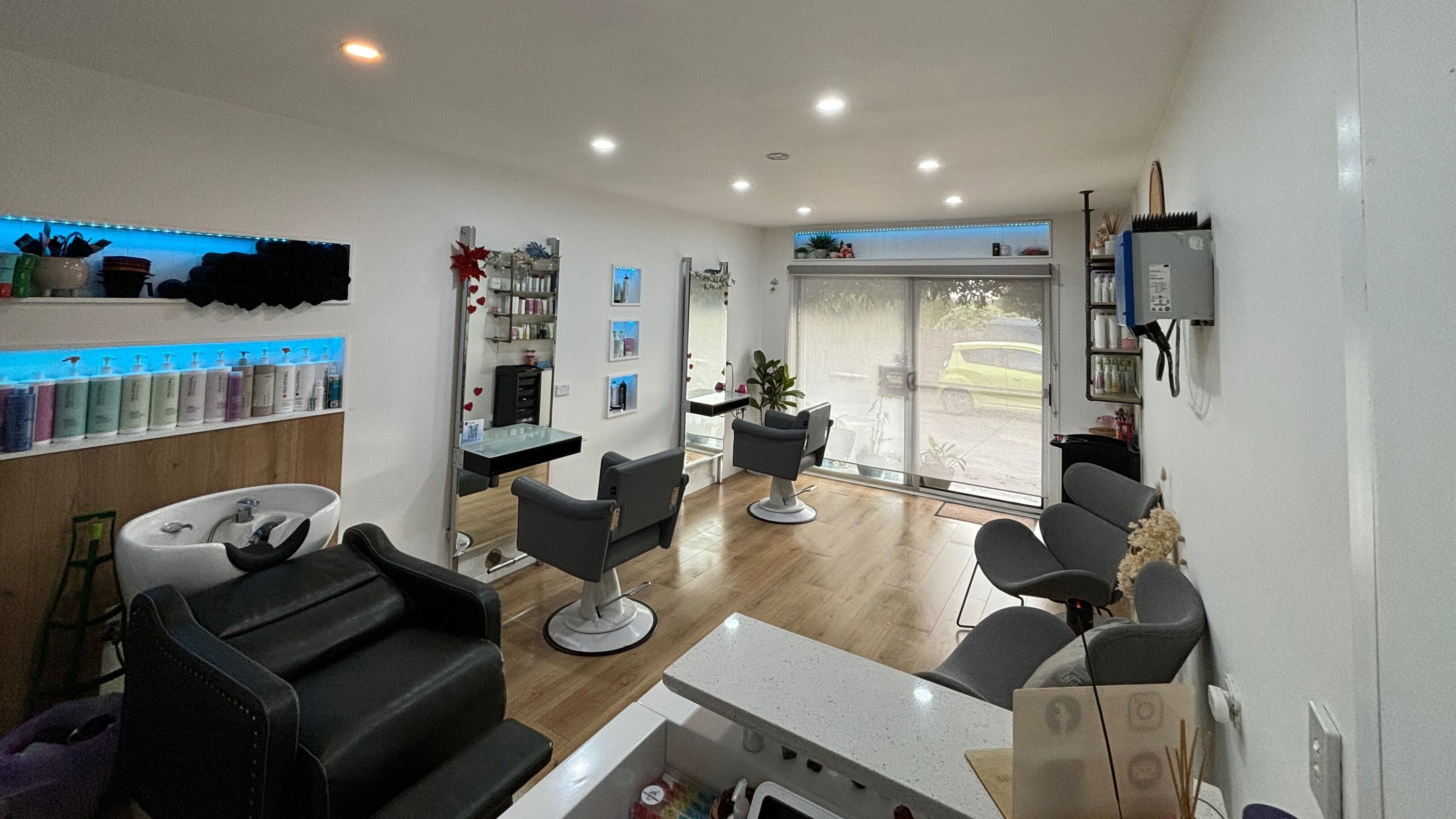 Modern salon interior at Hair by Karmen & Co in Melbourne, Victoria, AU, featuring stylish chairs and decor.