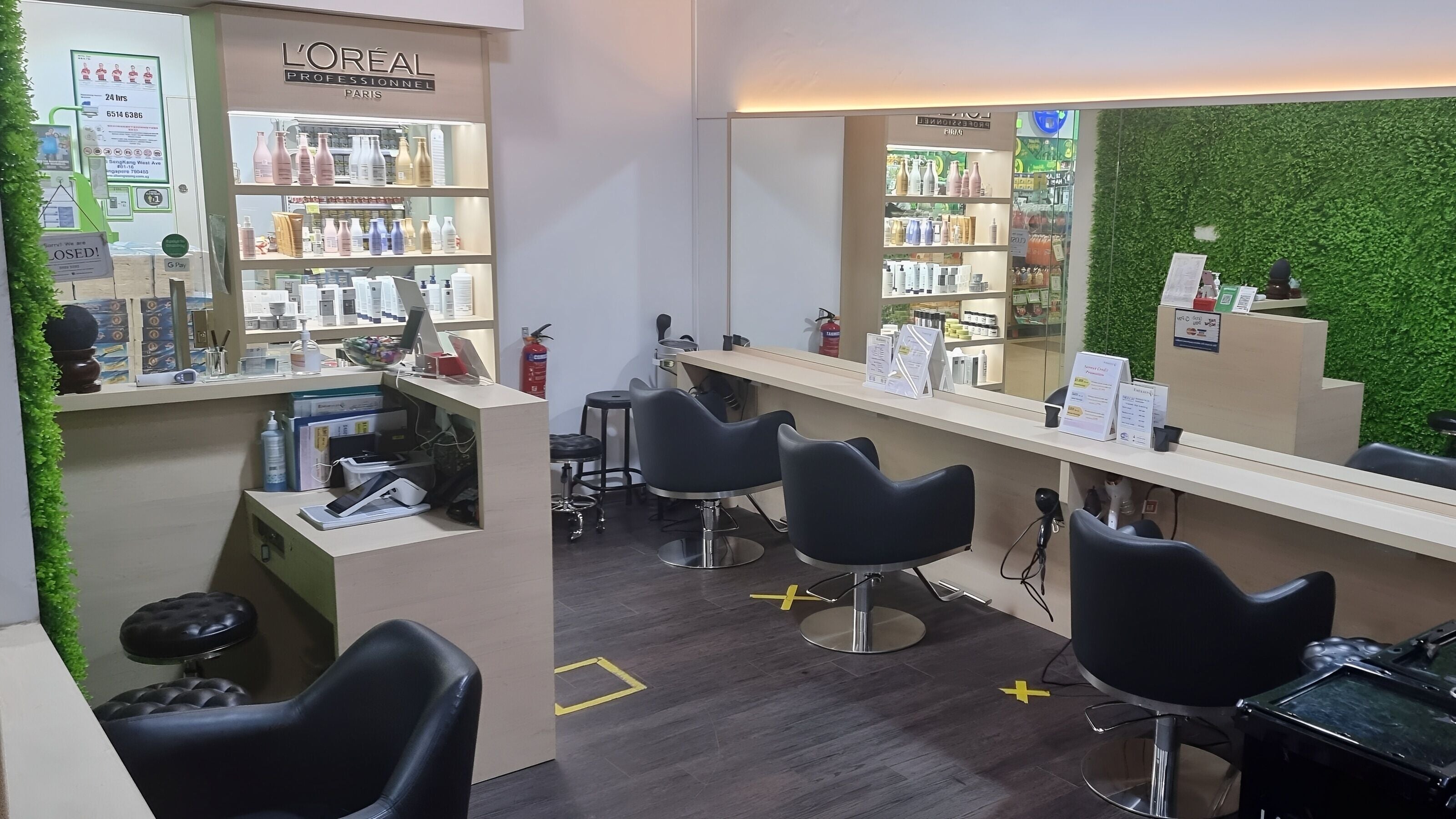 Modern interior of Emerald Hair Studio (Seletar) in Singapore, Singapore, SG with sleek styling chairs.