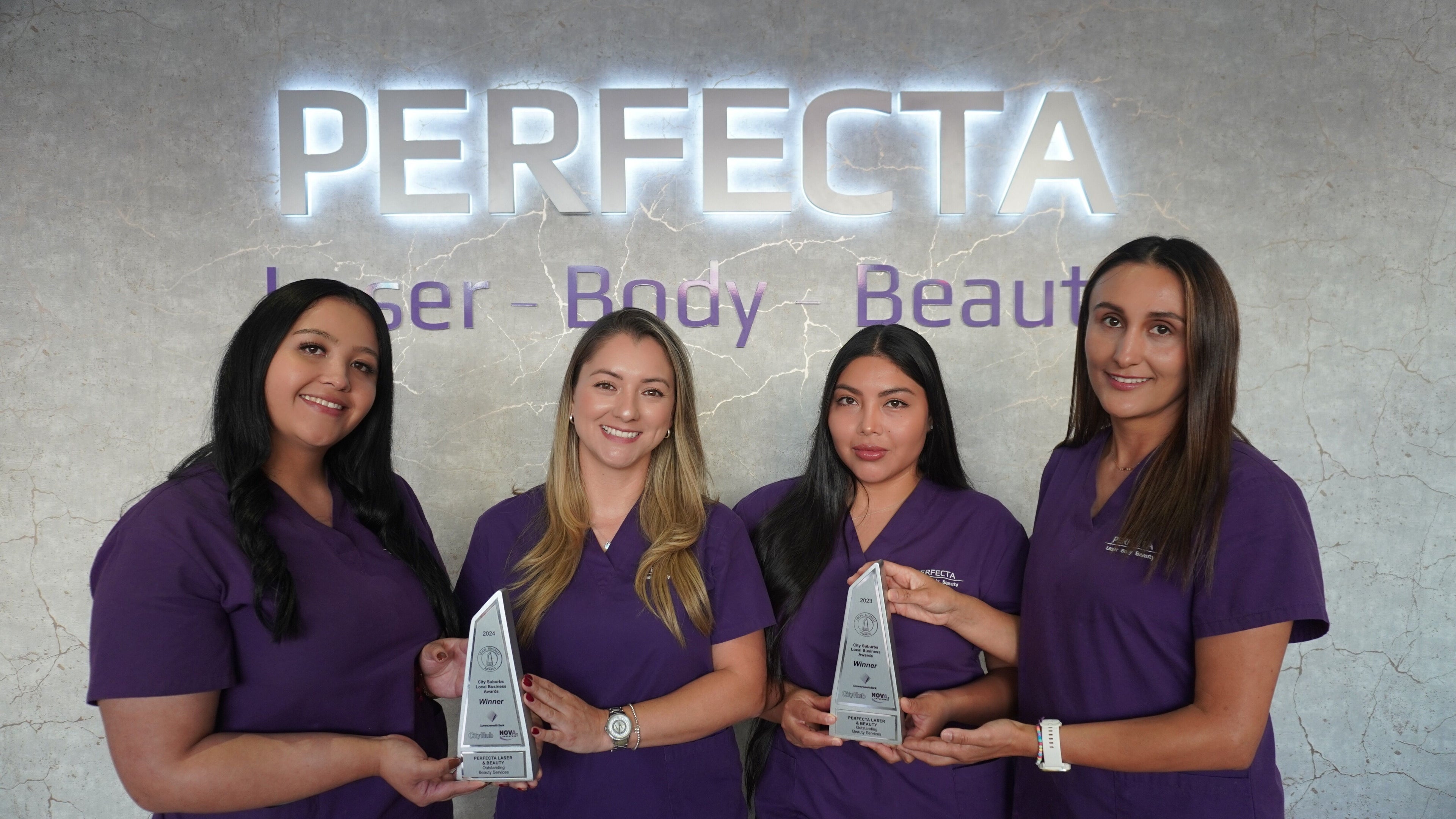 Team at PERFECTA Laser - Body - Beauty Surry Hills proudly displaying awards in Surry Hills, New South Wales, AU.