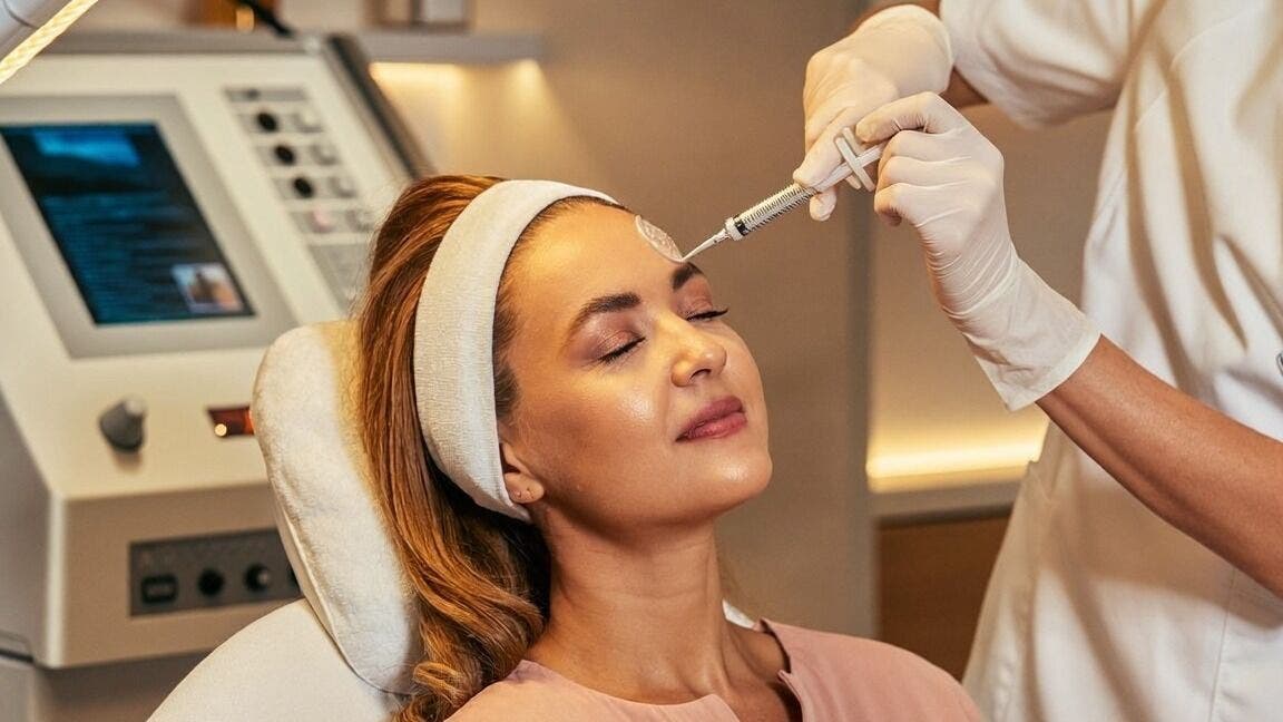 Beauty treatment at Asunshine Medspa NY in Mineola, New York, US. Technician provides rejuvenating facial therapy.