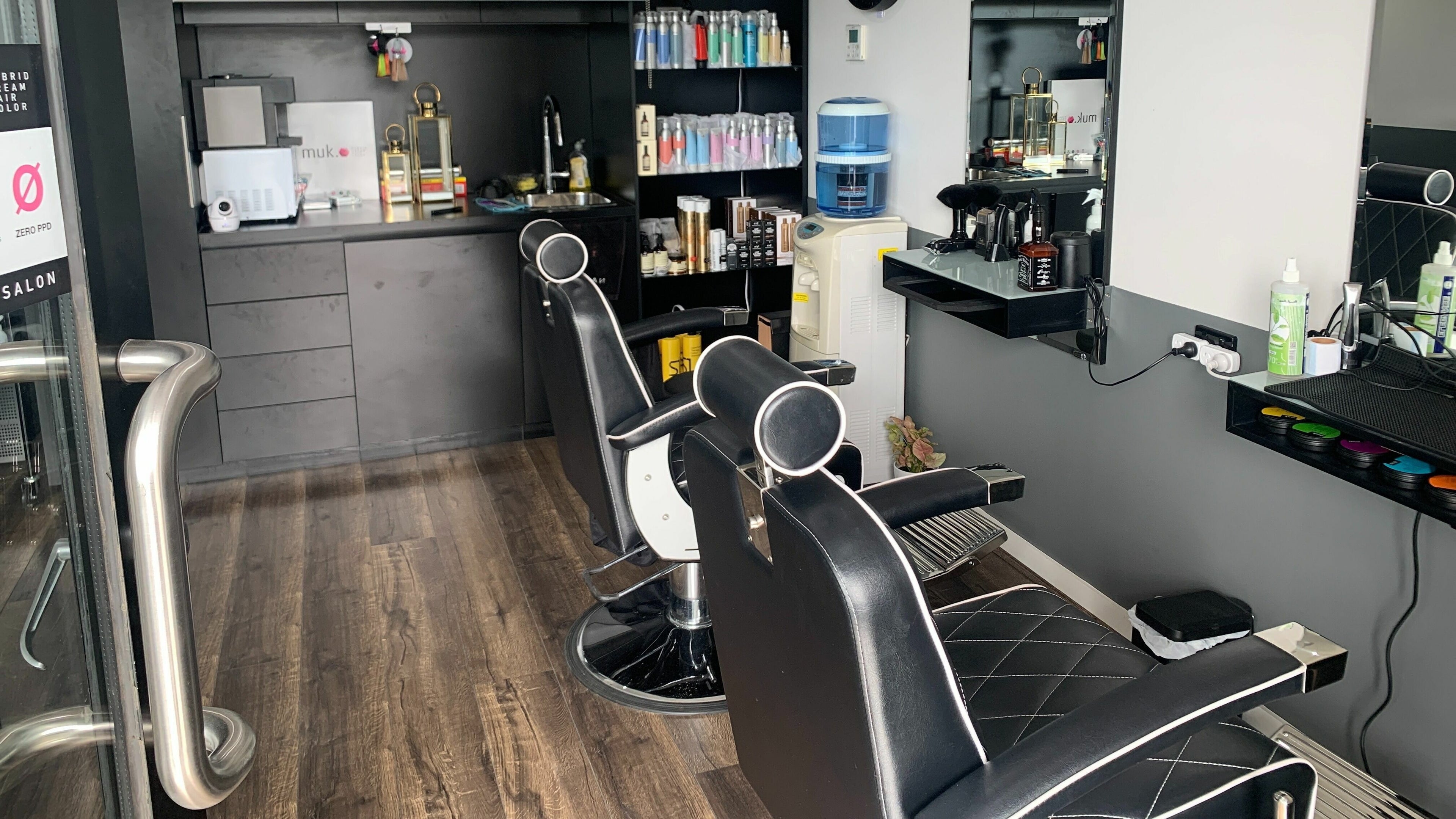 Modern interior of Darem Salon in Melbourne, Victoria, AU showcasing sleek styling chairs and equipment.