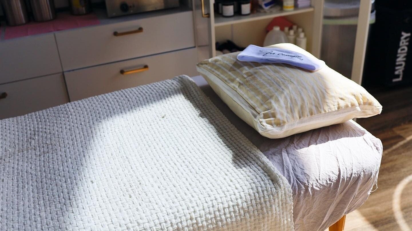 Cozy treatment bed at Fi.R Cosmetics LLC, Methuen, Massachusetts, US, perfect for a relaxing retreat.
