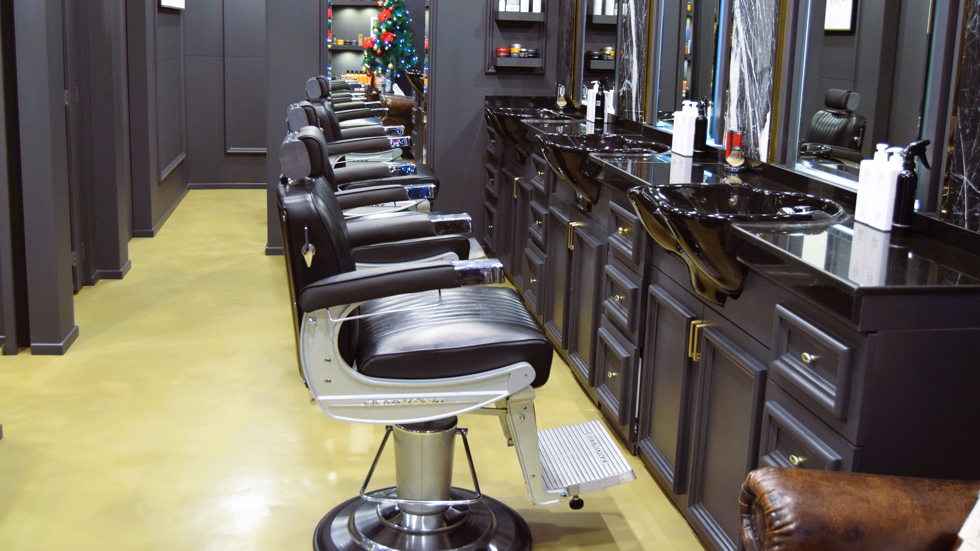 Elegant barber chairs at UB Grooming Salon Ltd. DIFC, Dubai, AE, offering a luxurious grooming experience.