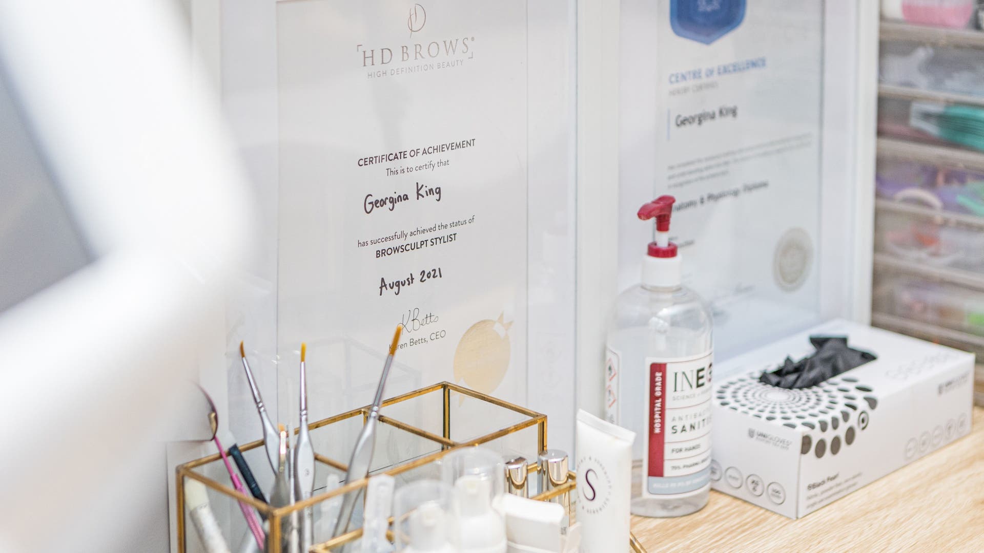 Certificates and beauty tools at Georgina Sookias in London, England, GB, showcasing expertise in beauty treatments.