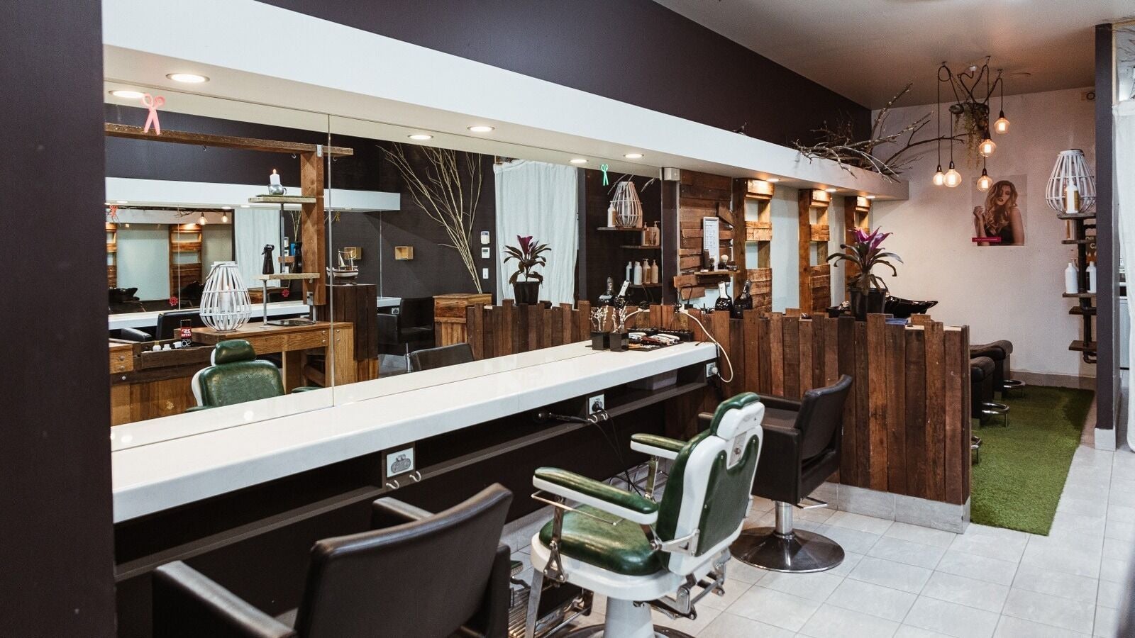 Interior of Epoch Hair salon in Redbank, Queensland, AU featuring stylish chairs and wooden decor.
