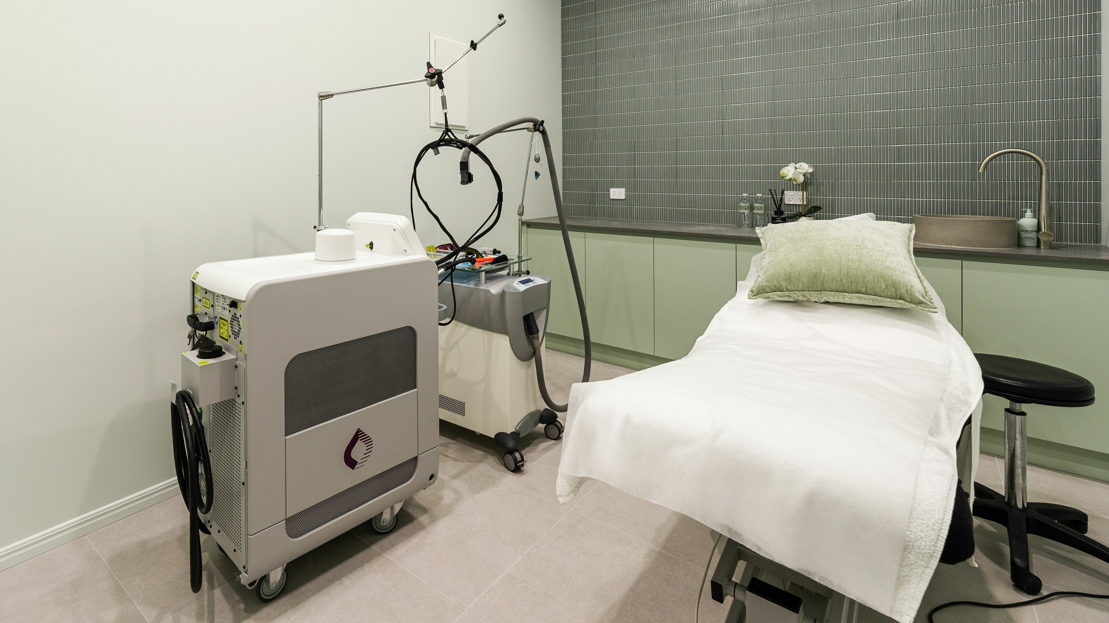 Modern treatment room at IINSKIN, Biggera Waters, Queensland, AU, featuring advanced skincare equipment.
