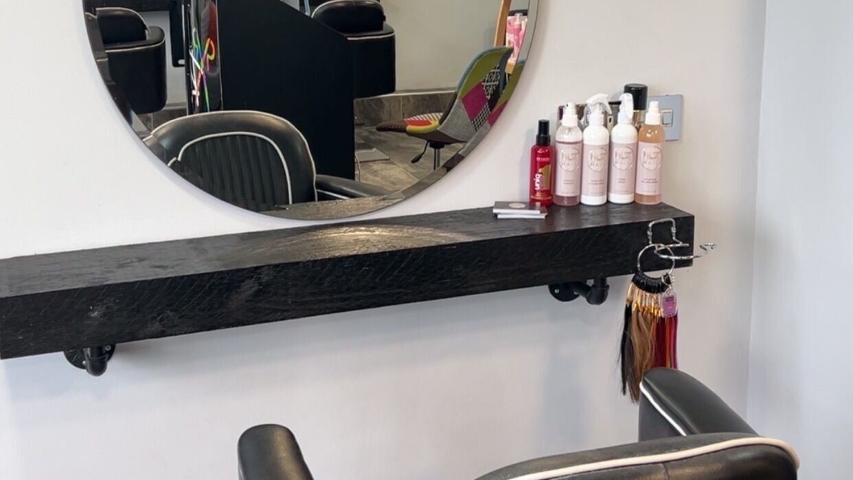 Modern salon station at NLWHair with products on display, Hull, England, GB.
