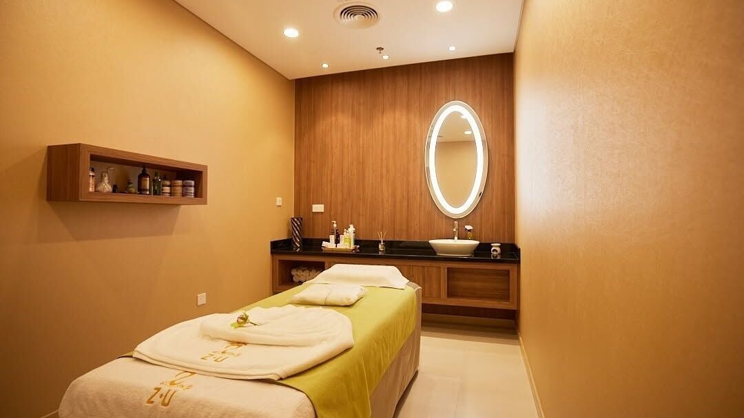 Relaxing spa treatment room at ZU Ladies Wellness Spa, Dubai, Dubai, AE with soothing lighting and modern decor.