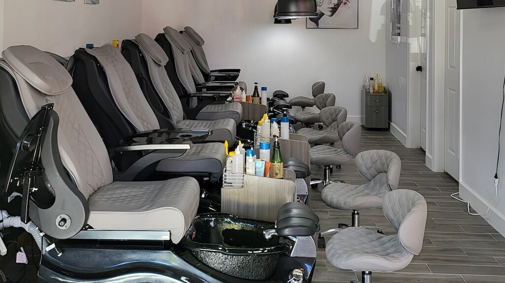 Luxurious pedicure chairs at Q Nails & Spa, Boston, Massachusetts, US, offering relaxing beauty services.