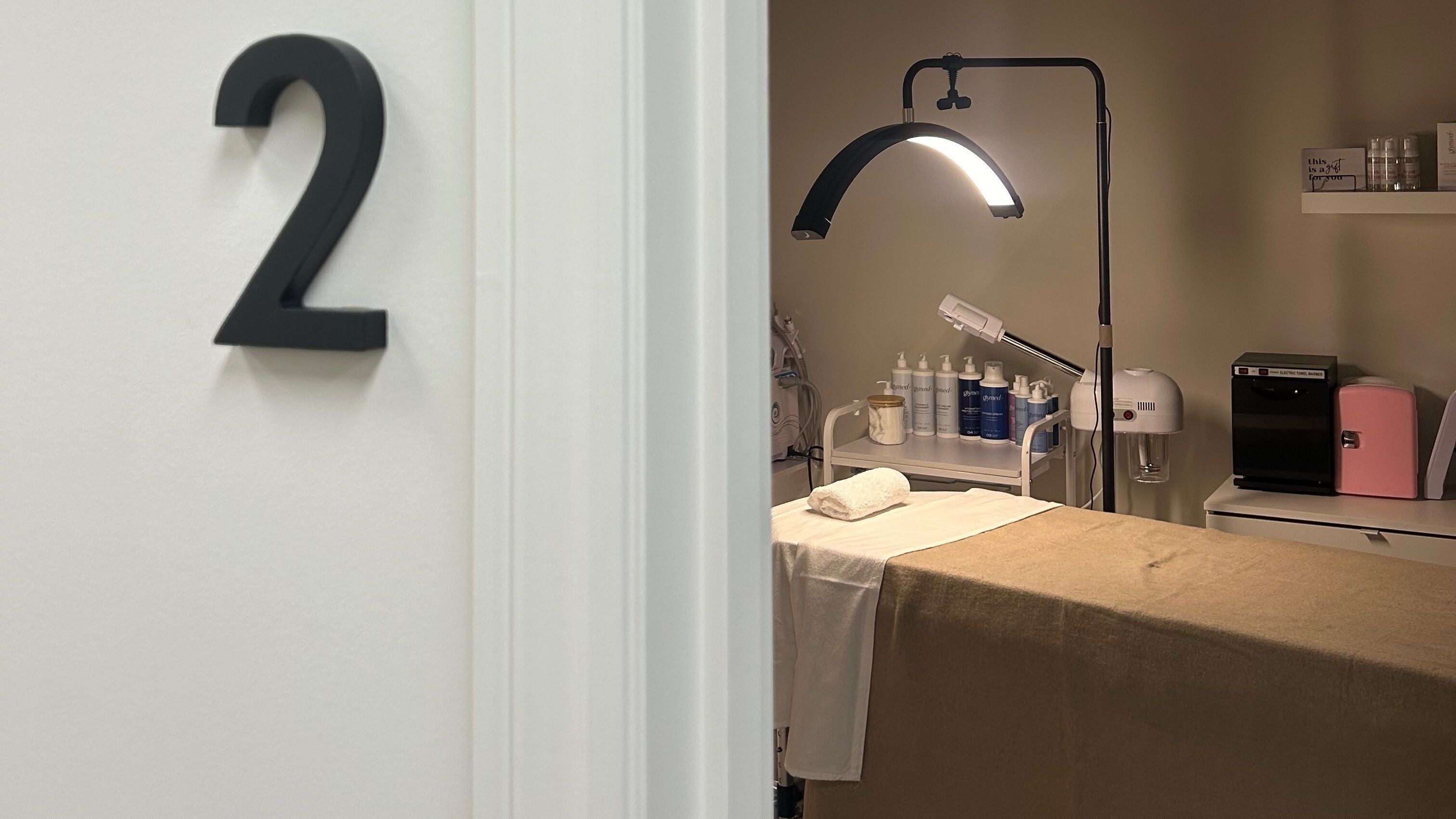 Treatment room number 2 at Aligned Aesthetics Studio in Vaughan, Ontario, CA, with a spa bed and equipment.