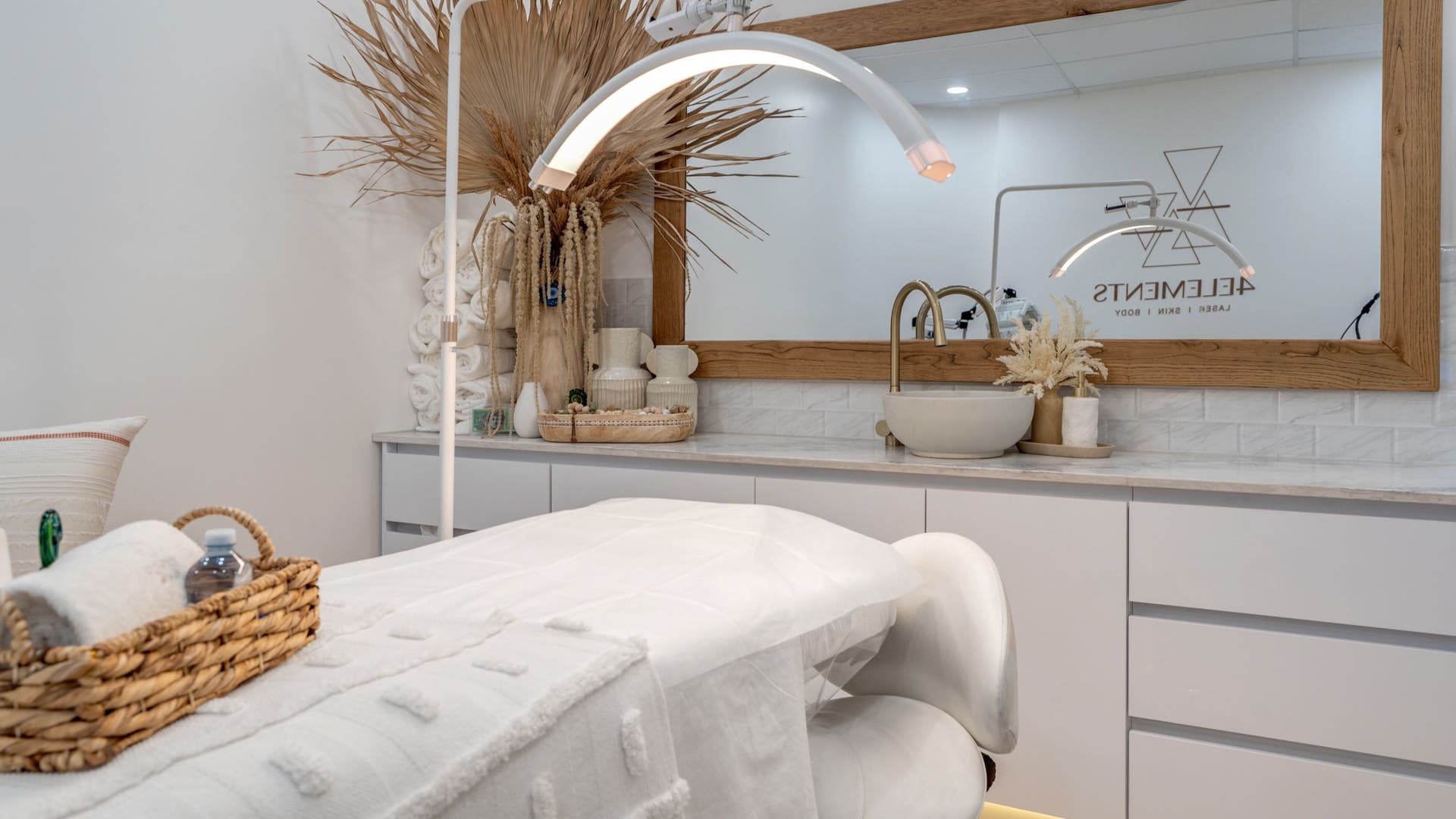 Luxurious treatment room at 4 Elements Clinic, Melbourne, Victoria, AU with elegant decor and plush bedding.
