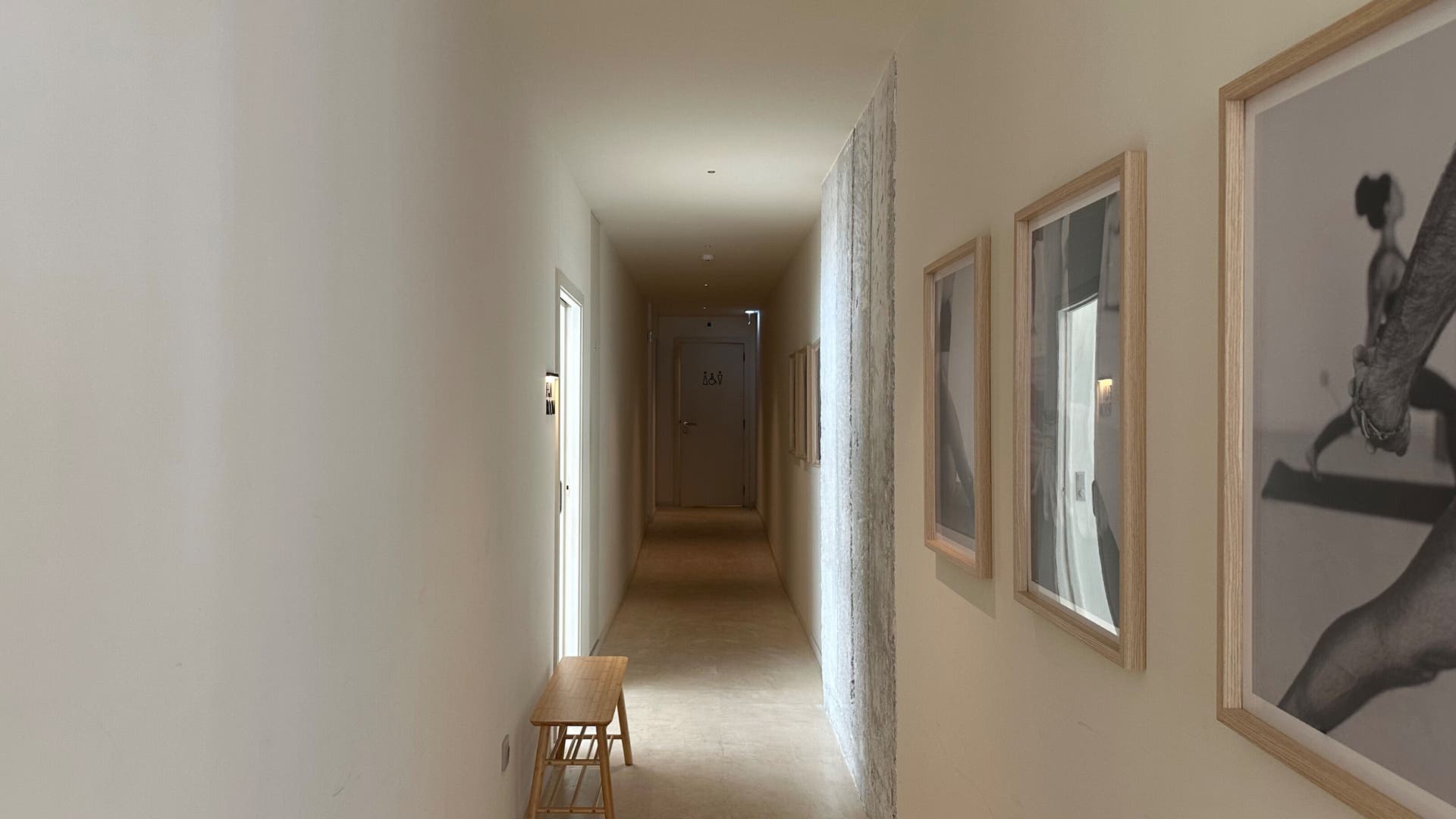 Hallway with art at SKIIN (at VARD), Valongo, Porto, PT. Minimalist decor enhances calm and relaxation.