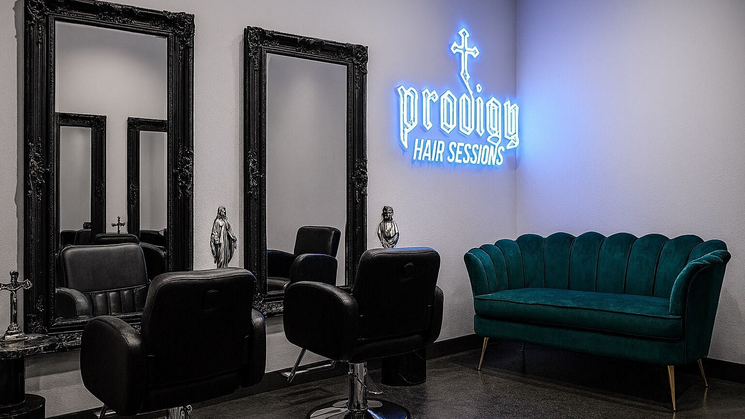 Luxurious interior of PRODIGY HAIR SESSIONS, Melbourne, Victoria, AU, featuring chic mirrors and plush seating.