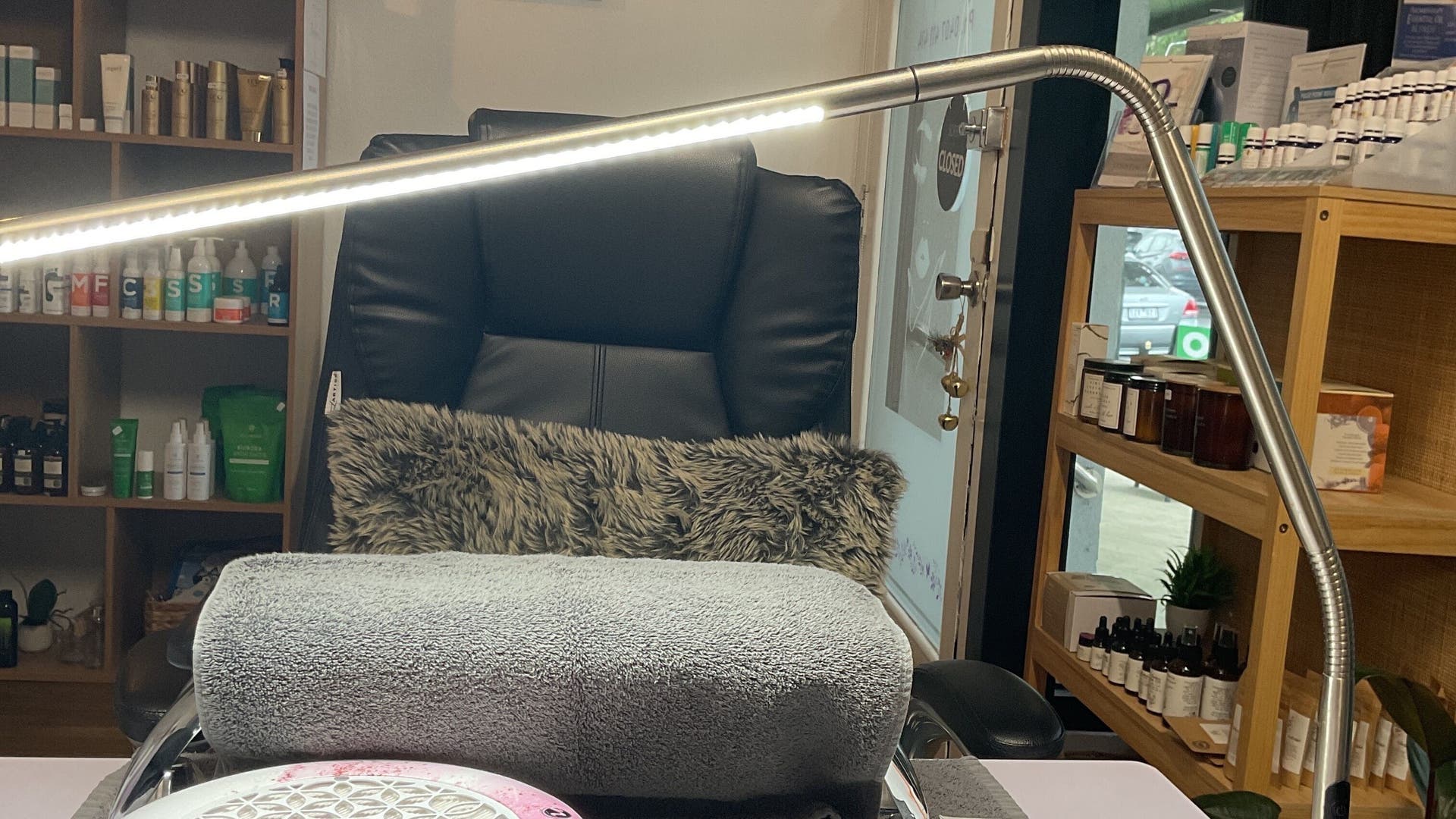 Comfortable manicure station at Nails & More Salon, Maffra, Victoria, AU with plush chair and products.