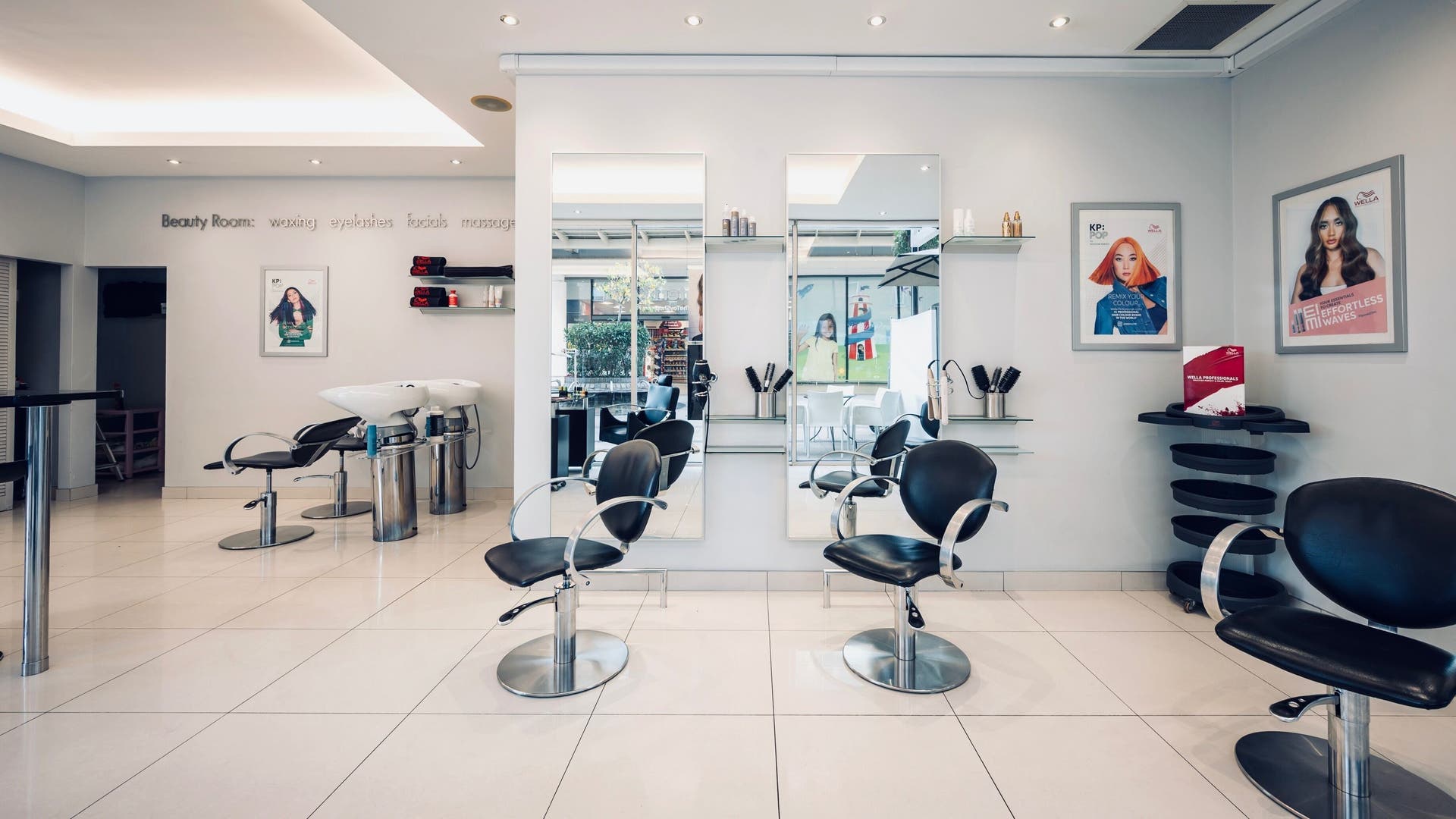 Modern salon interior with styling chairs at Vida Hair & Beauty The Brewery, Romford, England, GB.
