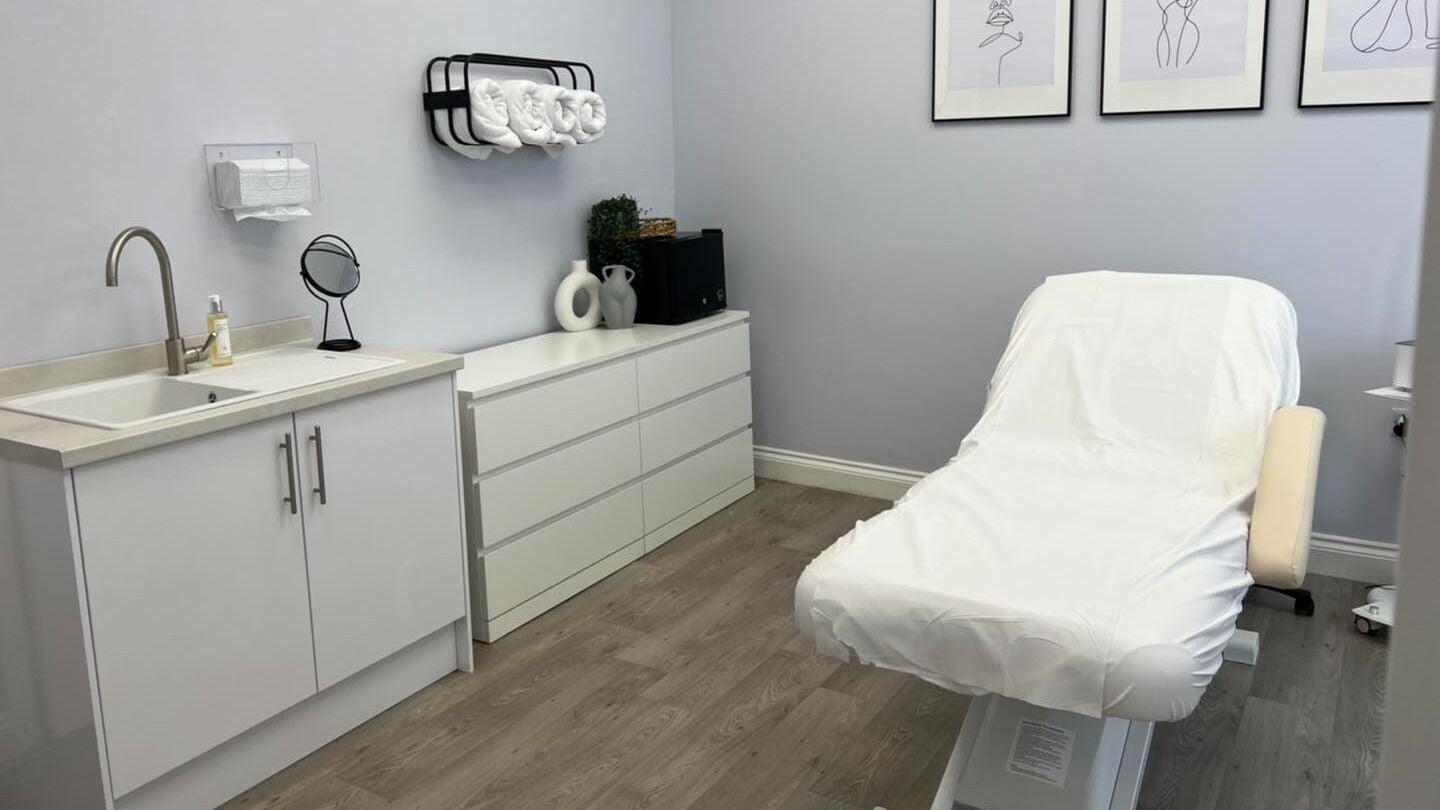 Minimalist treatment room at Skin Clinic, Douglas, Douglas, IM features a treatment bed and modern decor.