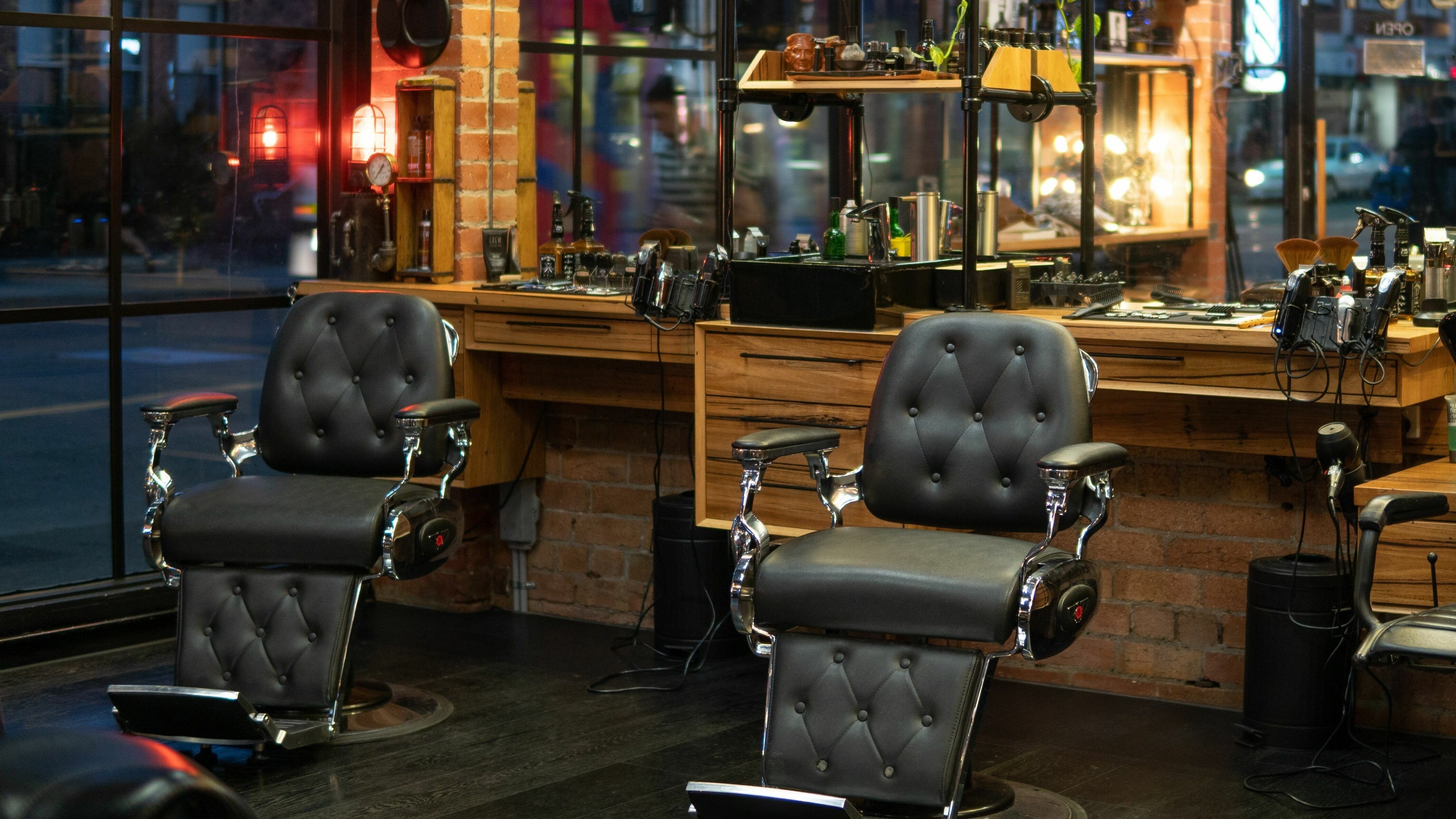 Elegant leather barber chairs at Edward Scissorhands in Melbourne, Victoria, AU, offering a vintage vibe.