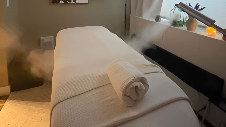 Relaxing spa treatment bed at Sass Lash & Beauty Co. in Colborne, Ontario, CA, ready for a tranquility session.