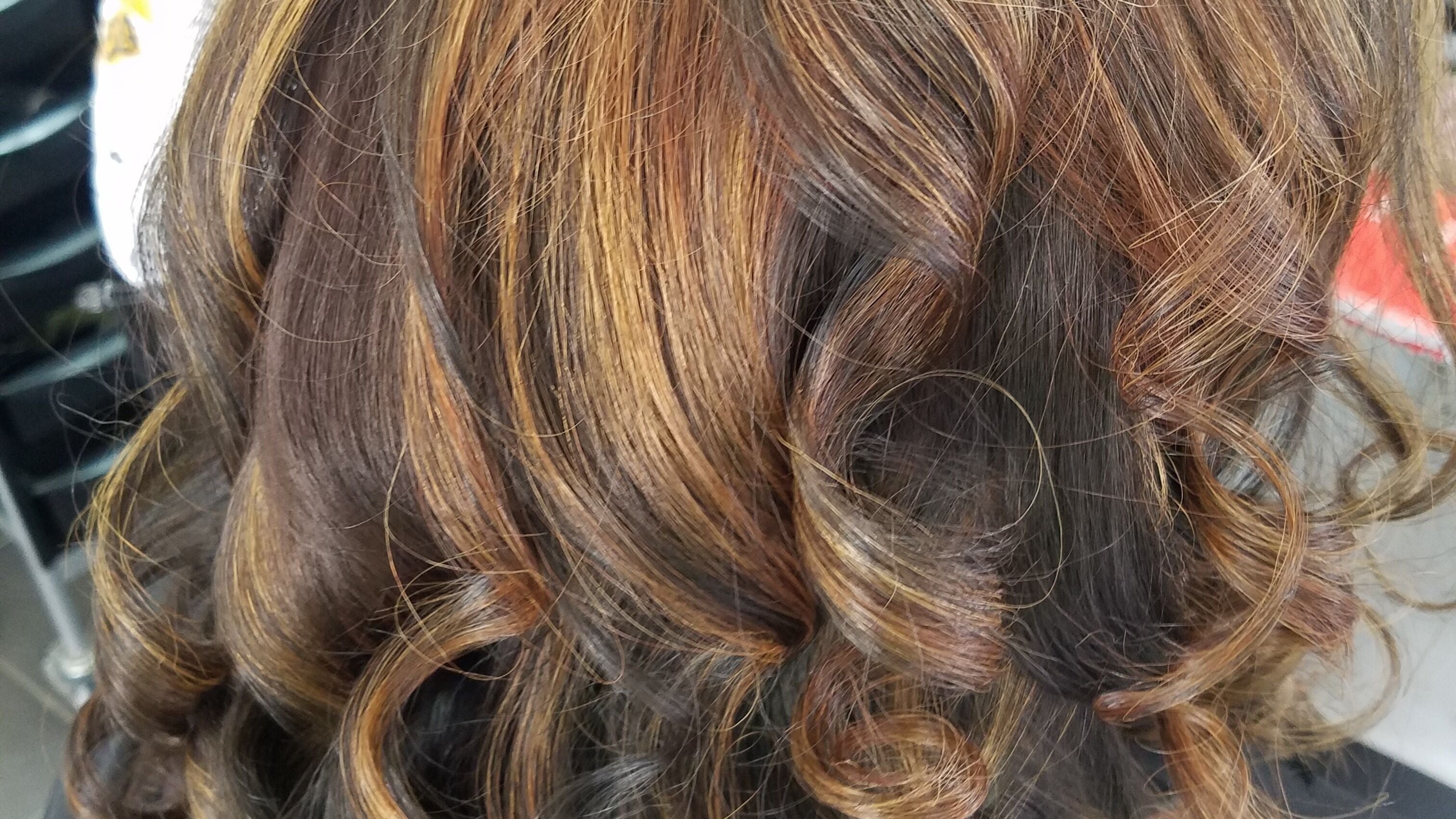 Styled golden brown curls at Stylistics Hair Studio in Cape Town, Western Cape, ZA.