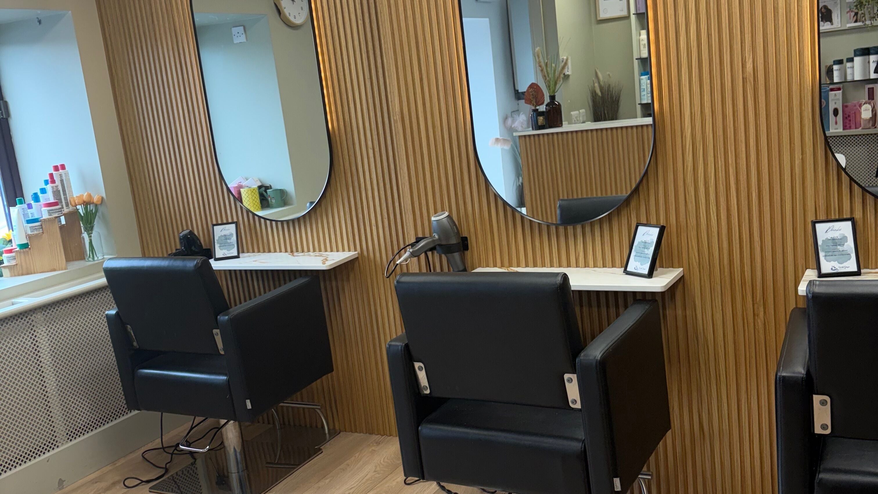 Modern salon chairs and mirrors at Wild Ginger Innovative Hair, Nenagh, County Tipperary, IE.