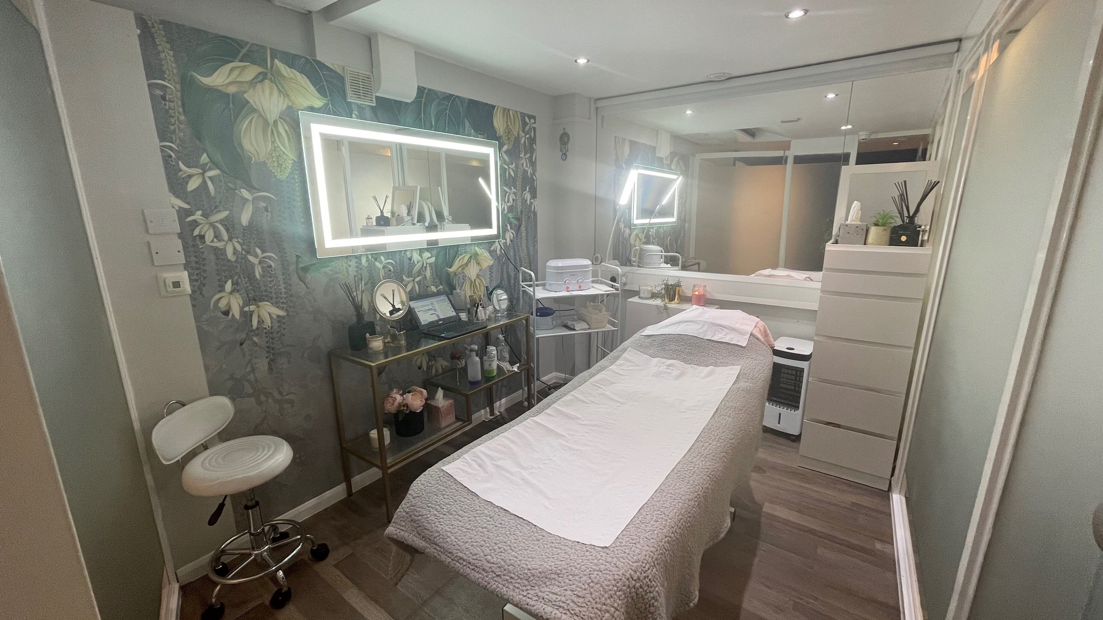 Luxurious treatment room at Wax and Brows by Mina, London, England, GB with elegant decor and modern amenities.