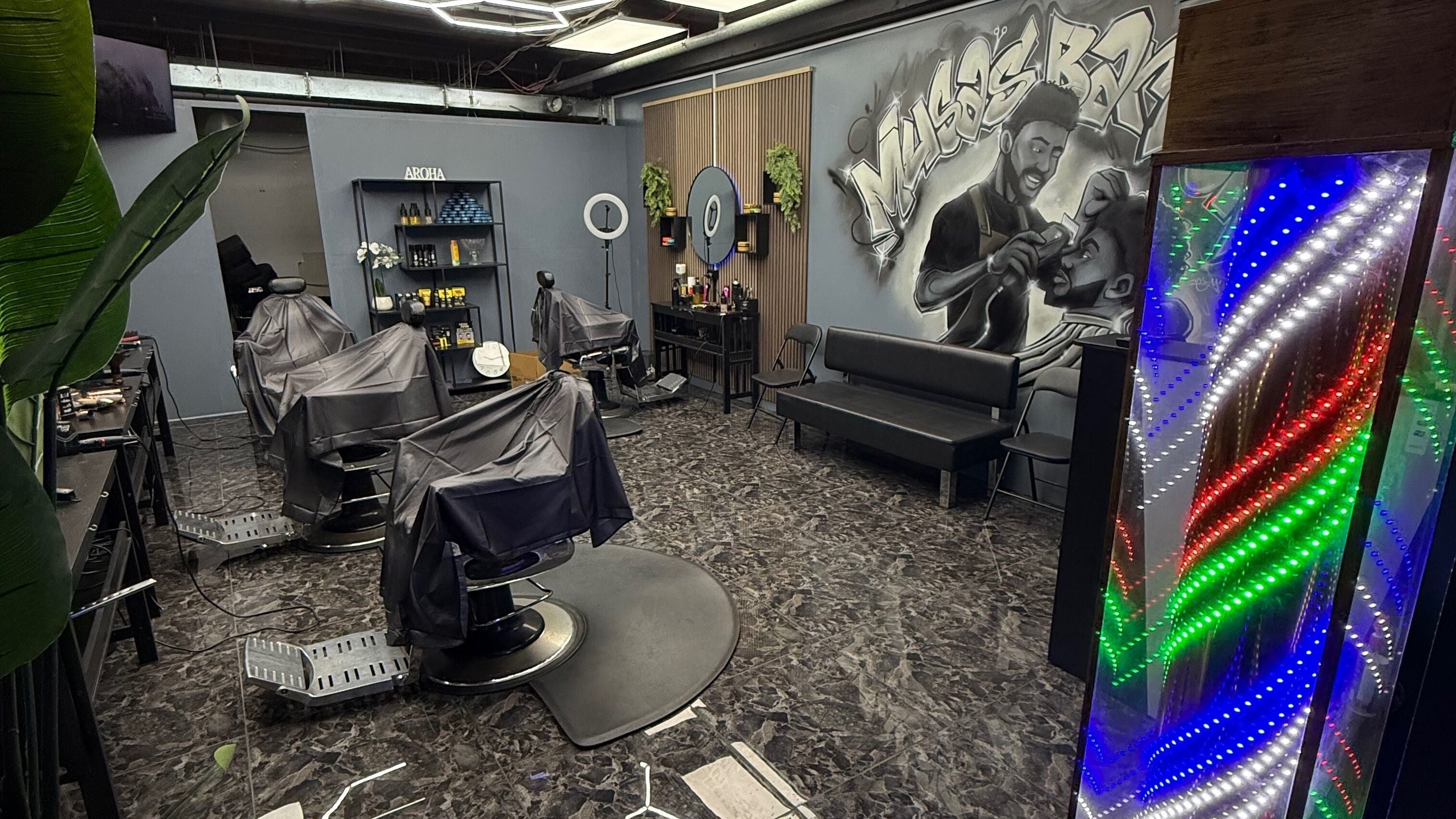 Modern interior of Musa’s Barber Auckland, featuring stylish chairs and vibrant decor. Located in Auckland, Auckland, NZ.