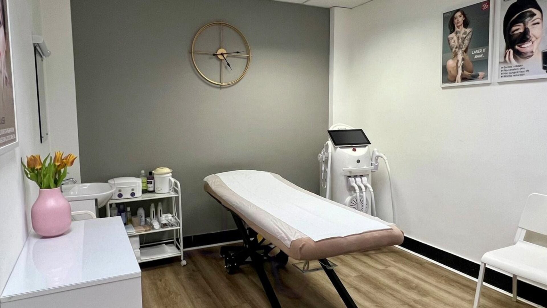 Skimprove treatment room in London, England, GB with a cozy bed and modern equipment for wellness services.
