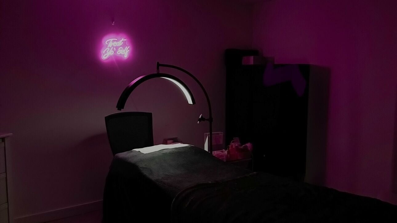 Relaxing treatment room at Beauty Arcade, West Leederville, Western Australia, AU with calming purple lighting.
