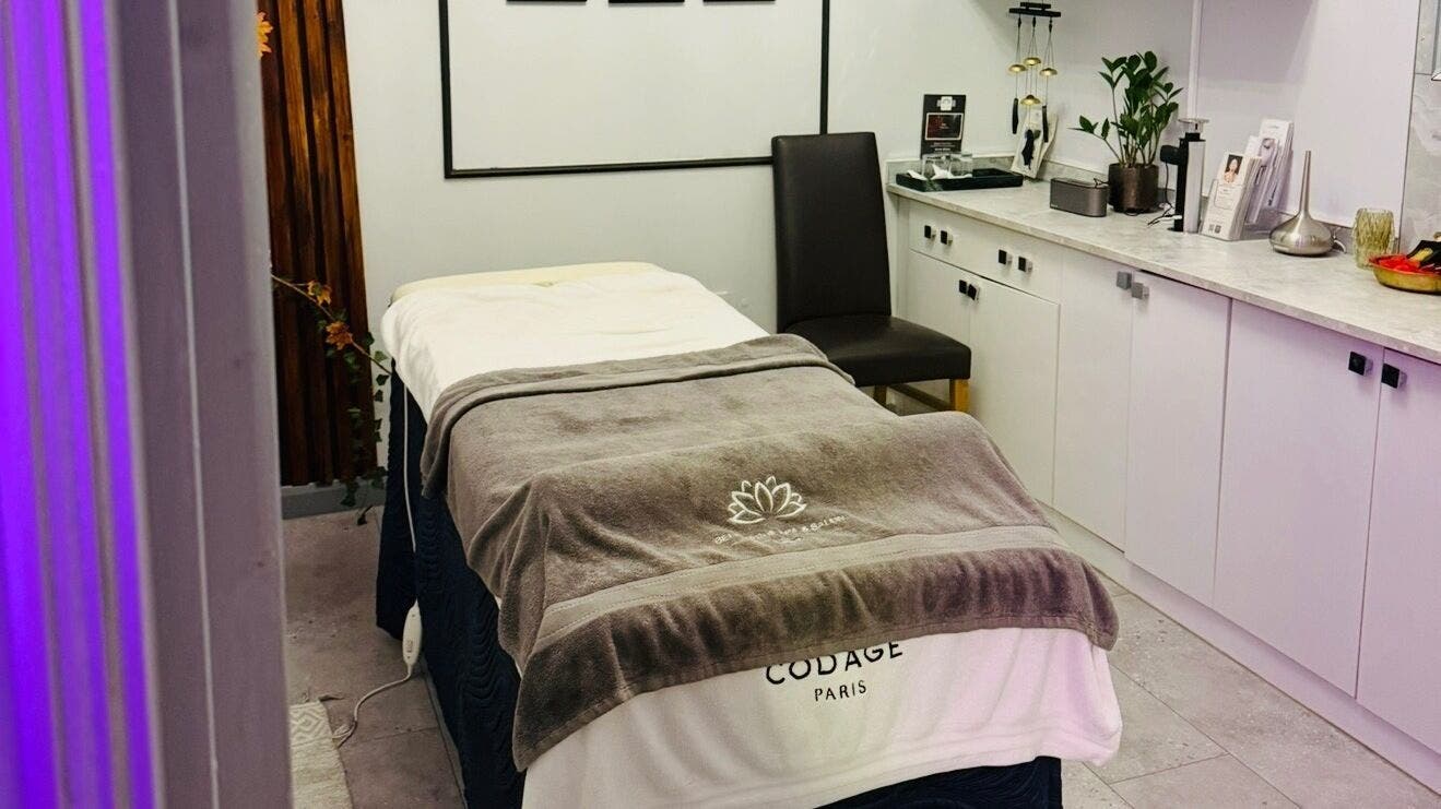 Cozy spa room at Belle Vous Spa Nine Elms, London, England, GB with massage bed and serene decor.