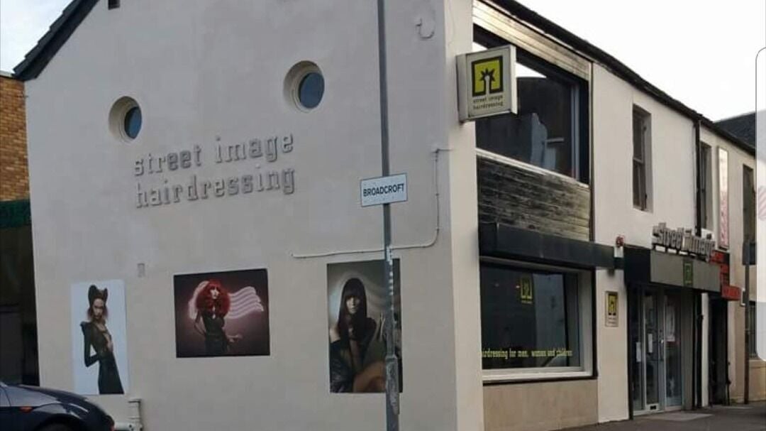 Street Image Hairdressing front view in Kirkintilloch, Scotland, GB showcasing its stylish modern facade.