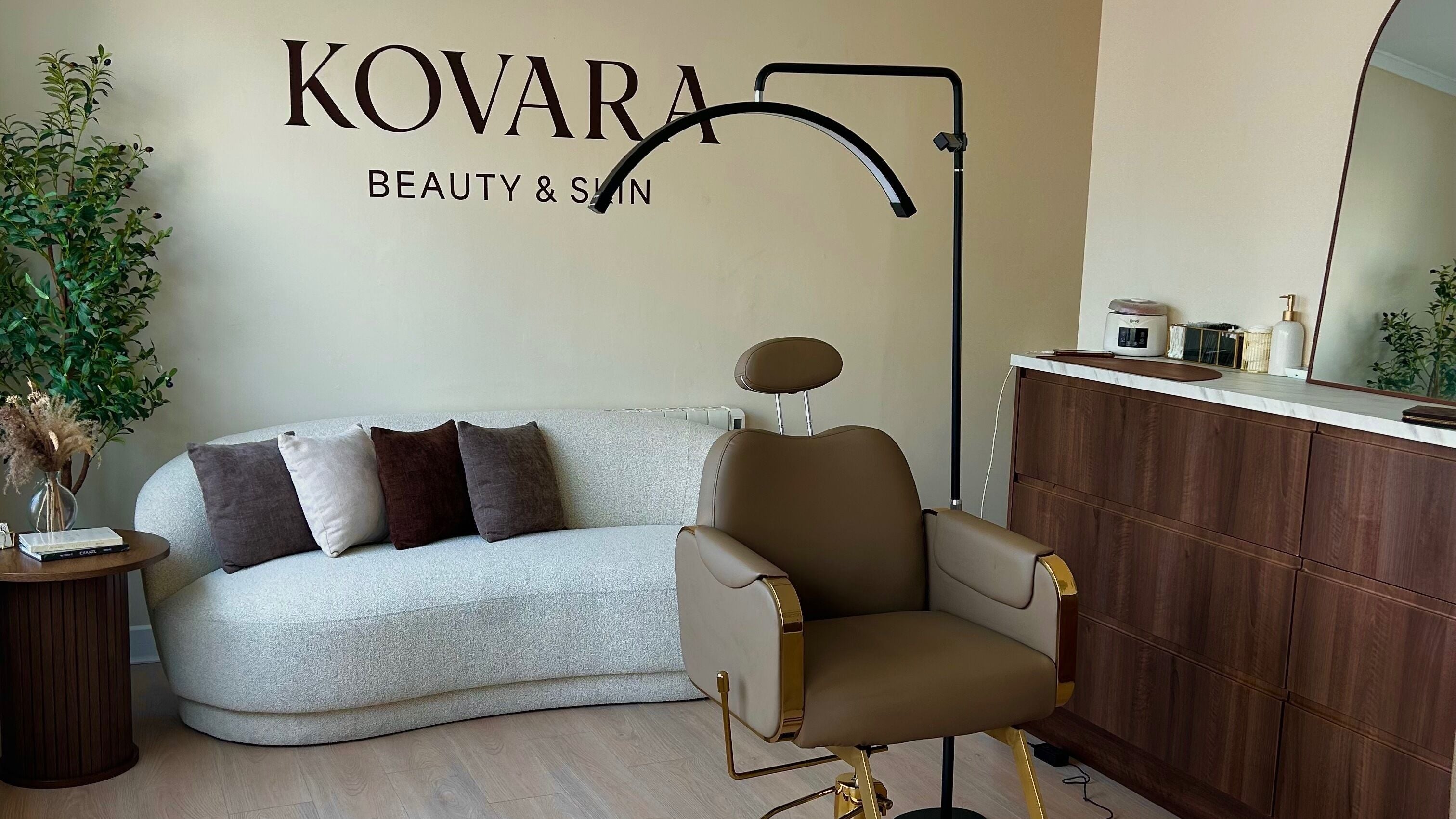 Stylish salon interior at Kovara Beauty in Celbridge, County Kildare, IE featuring a modern chair and elegant decor.