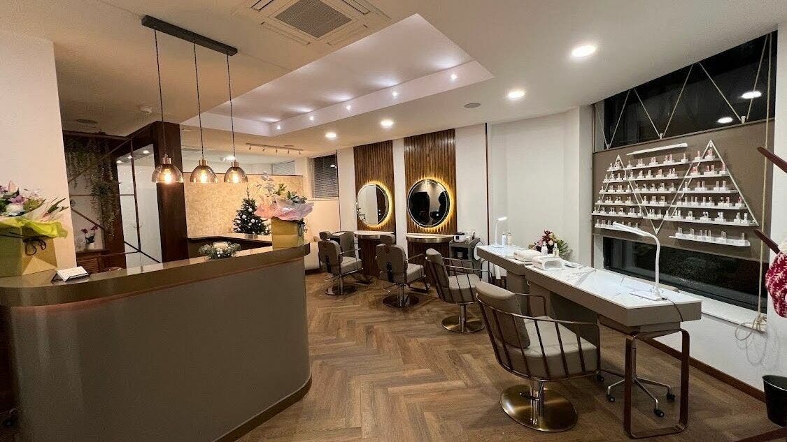 Modern and stylish salon interior of PK Aesthetic in Glasgow, Scotland, GB showcasing chic decor and mirrors.