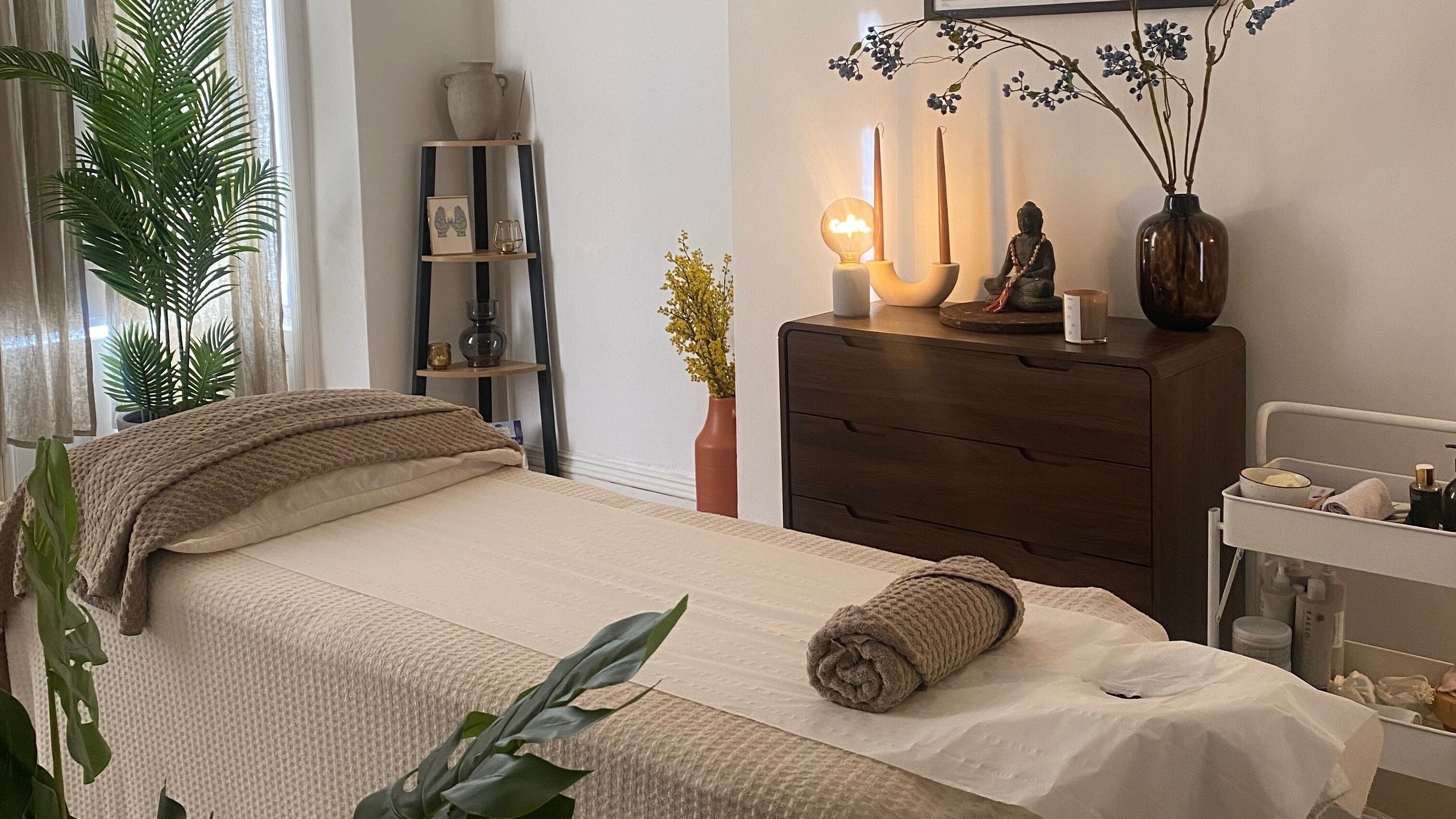 Peaceful massage room at Mind Body Massage, Brighton And Hove, England, GB with serene decor and soft lighting.