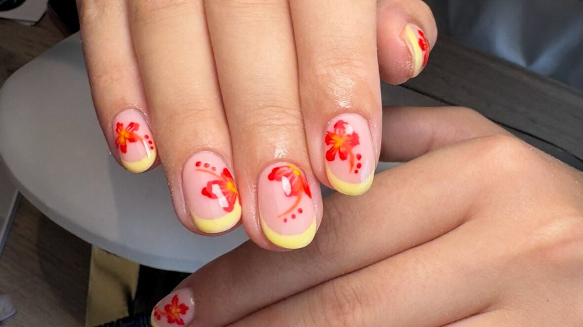 Vibrant floral nail art design at Create By Chloe, Bishopbriggs, Scotland, GB. Perfect for beauty enthusiasts.