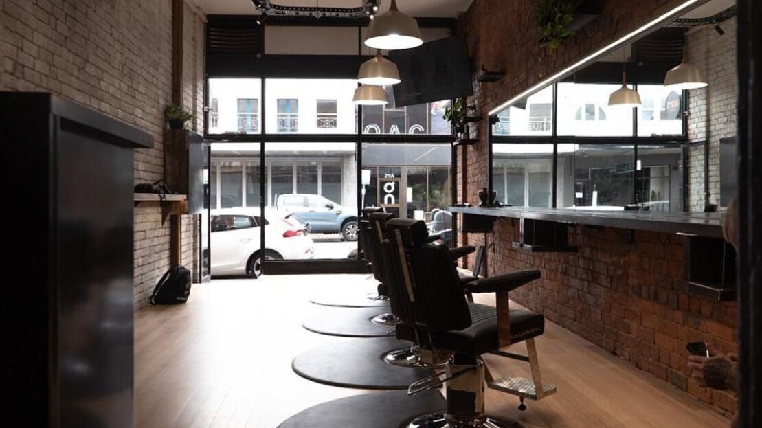 Stylish salon view at The Conductor Richmond, Richmond, VIC, AU with barber chairs and modern decor.