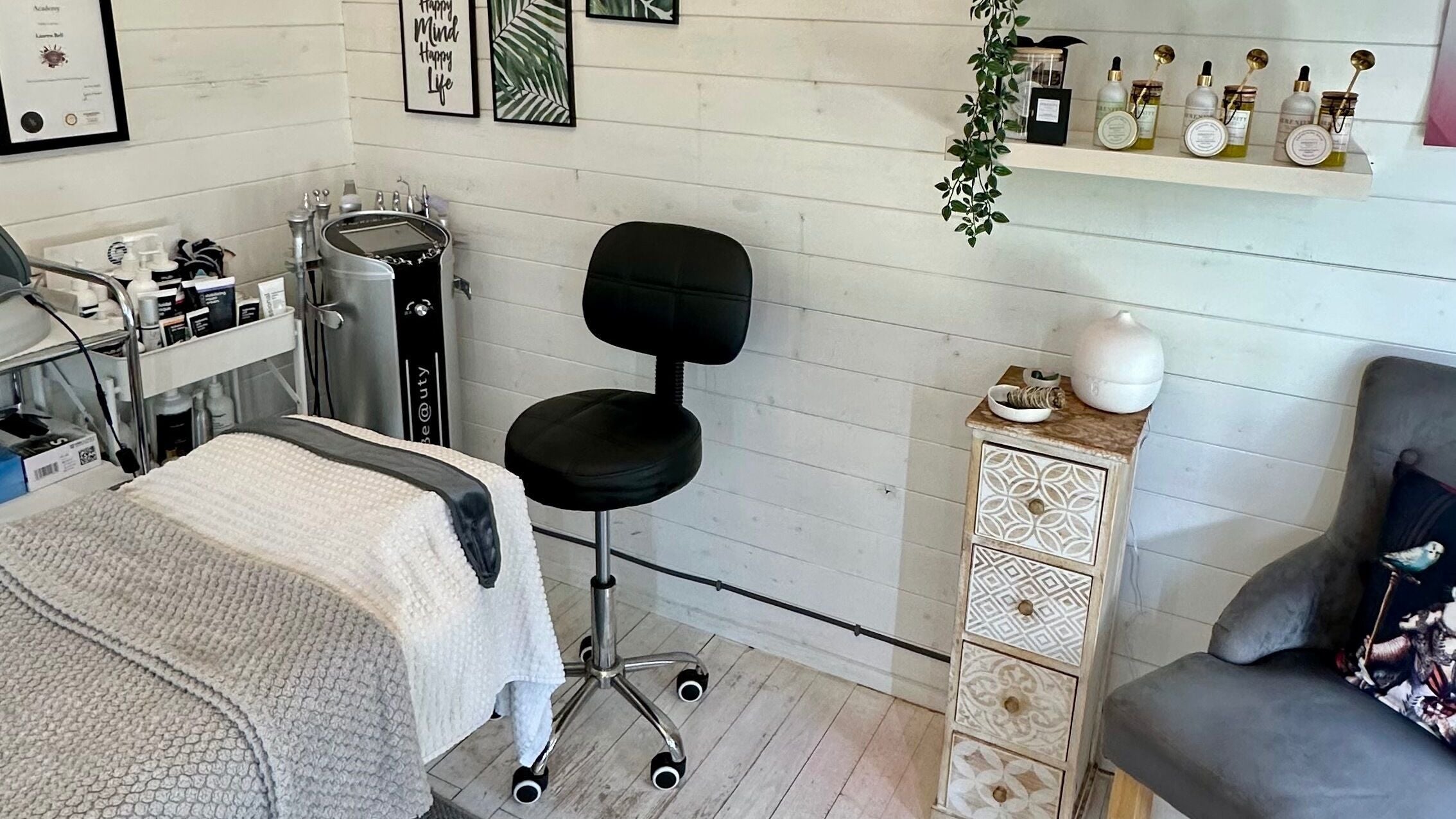 Cozy spa setup at The Beauty Hut - Ash with treatment bed and products in Ash, England, GB.