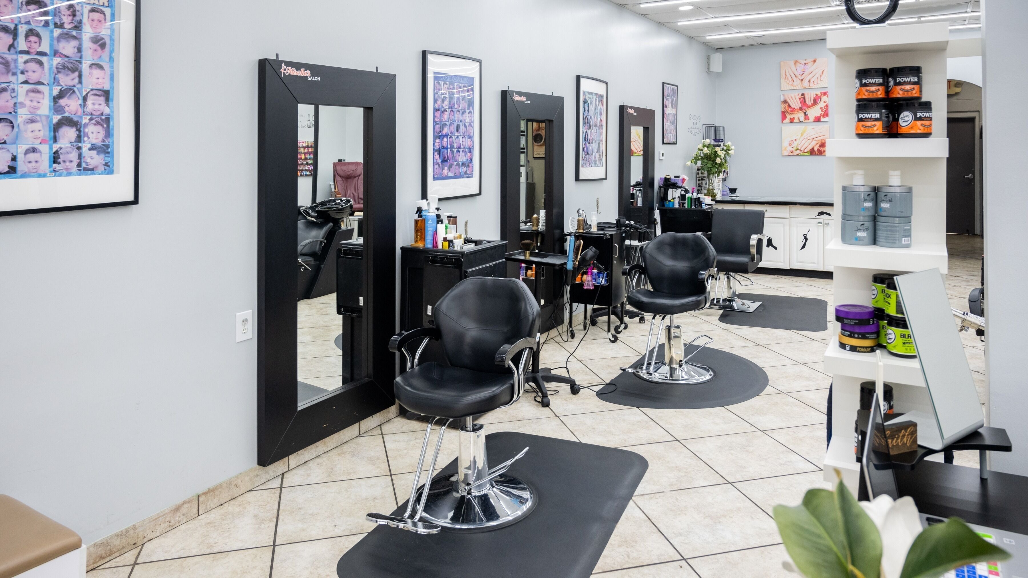 Modern salon interior at RUVI'S HAIR SALON, Kennesaw, Georgia, US with sleek styling chairs and hair care products.
