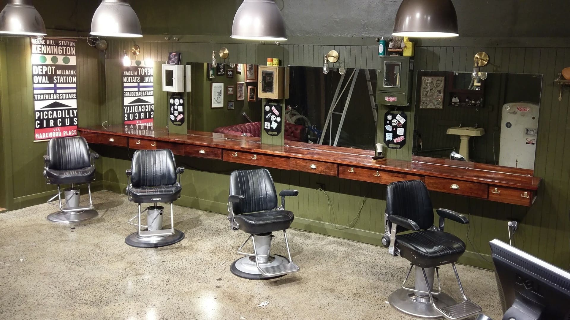 Chic interior of Celtic Tiger Barbers Elsternwick in Melbourne, Victoria, AU featuring vintage barber chairs.