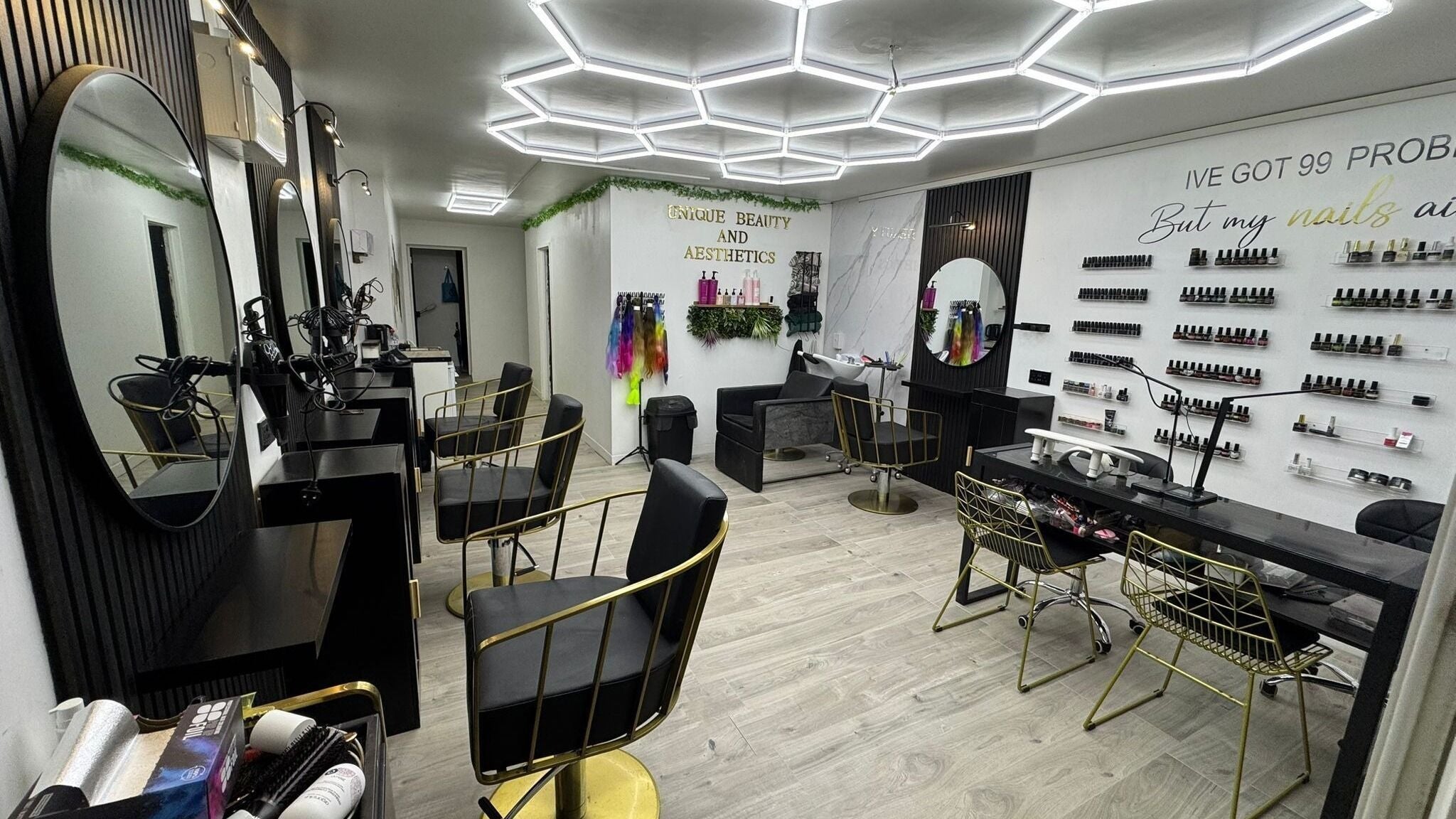 Modern salon interior of Unique Beauty and Aesthetics in Norwich, England, GB showcasing elegant seating and decor.